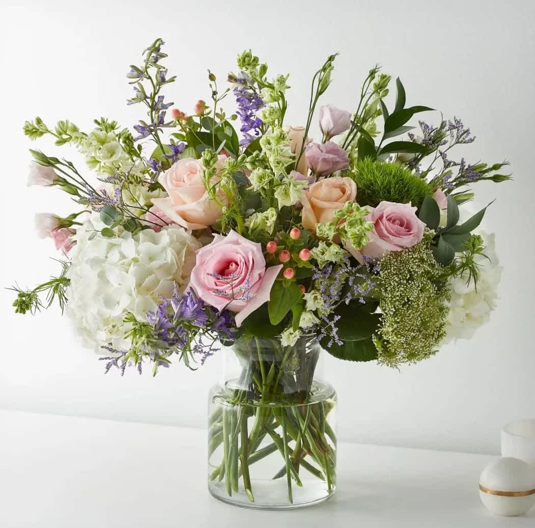Fresh-Picked Porcelain (BB) - Get lost in the enchanting beauty of the &quot;Fresh-Picked Porcelain&quot; arrangement, a delightful bouquet that evokes the imagery of a lush and bountiful garden. This stunning arrangement features a breathtaking combination of pink roses, white hydrangeas, and a variety of other mixed flowers.