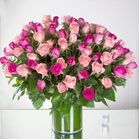 Pink Splendor (BB) - This beautiful arrangement is a celebration of elegance, romance, and pure enchantment. It features 100 assorted pink roses that have been carefully selected to showcase a variety of shades, ranging from soft pastels to vibrant magentas. Each rose is a testament to love, affection, and admiration, and together they create a visually stunning display.