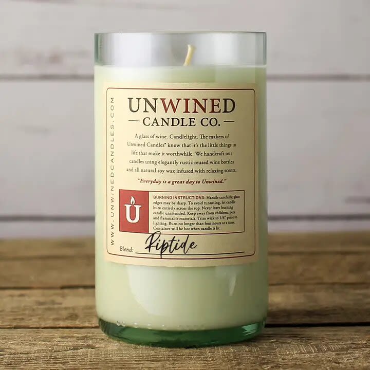 Riptide Signature Series - Wine Bottle Candle - Unwined's flagship product. Our Signature collection of candles are housed in recycled wine bottles, made from all-natural soy wax, 100% cotton wick and a blend of essential and artisan fragrances. Eco-friendly and clean burning, these beautifully handcrafted candles are sure to please!   *Please note, we collect bottles from our customer, who we like to call our “recycling partners”, local bars and restaurants. Bottle color shipped may vary from the image. All of our candles house 12 ounces of burnable wax, or about an 80 hour burn time. We will send you a variety of colors! We take great pride in keeping glass out of our landfills! Thanks for your support!!  Riptide Fragrance Notes:  Top: Bergamot Middle: Coconut, Gardenia Base: Amber, Vanilla  12 Ounce Soy Wax Candle / Approximate 80 Hour Burn Time