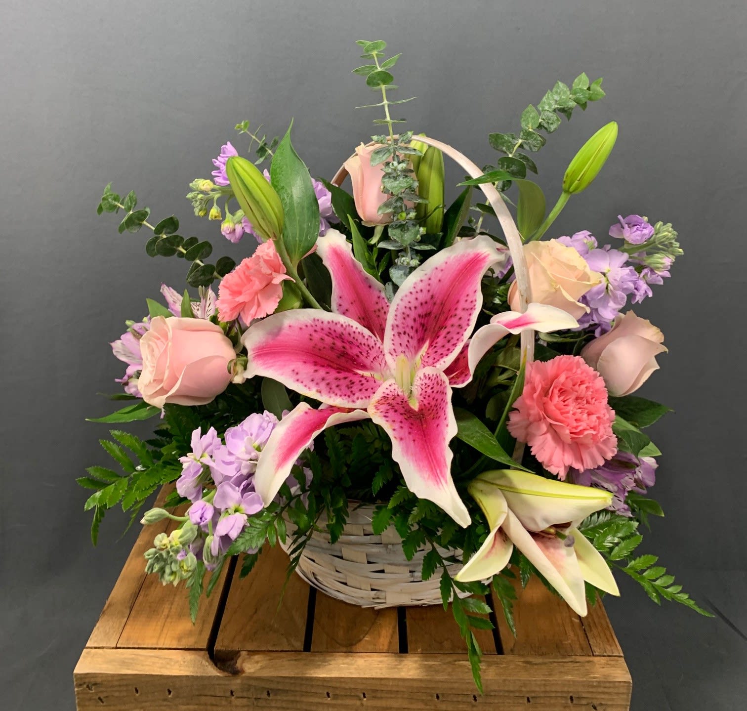 Basket Of Love (BB) - Lilies, roses, stock and more are arranged in a white washed basket. Assorted greenery including eucalyptus.... smells wonderful!