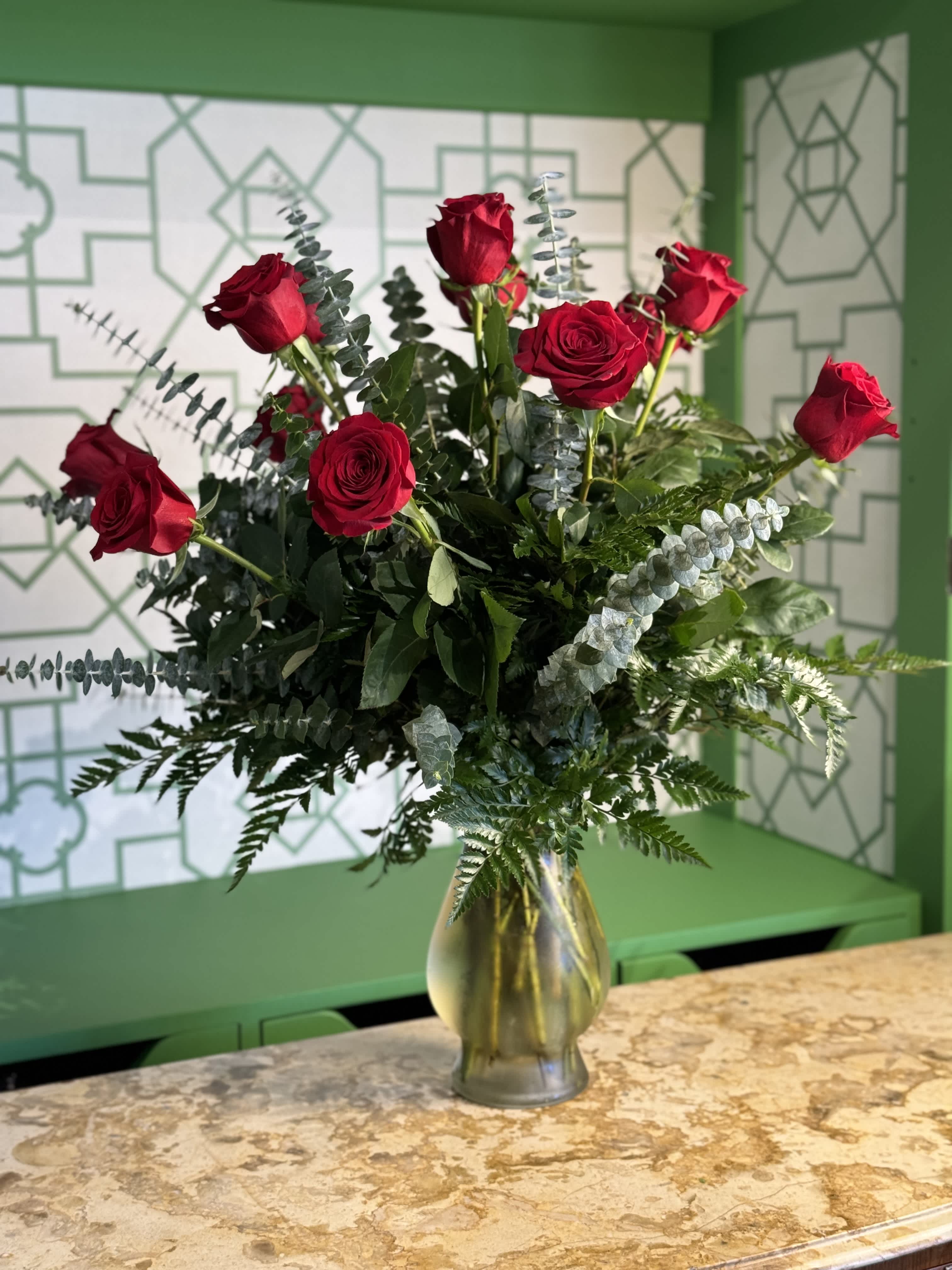 Dozen Long Stemmed Red Roses  - A timeless expression of love and admiration, this arrangement features one dozen premium long-stem red roses, elegantly presented in a clear glass vase. Perfect for romantic occasions, anniversaries, or simply saying &quot;I love you&quot; with style and grace.  Please note: Floral variety and vase may vary depending on availability, ensuring each arrangement is fresh and unique.  Freshness Guarantee: At Belden's Florist, we stand behind the quality of every arrangement. Our flowers are guaranteed to remain fresh and beautiful for 3–5 days after delivery. While cut flowers may naturally begin to wilt beyond this timeframe, we ensure that only the freshest blooms are selected and expertly arranged to bring joy and elegance to your space. To extend their life, we recommend refreshing the water in your vase daily, allowing your flowers to stay hydrated and continue to dazzle.