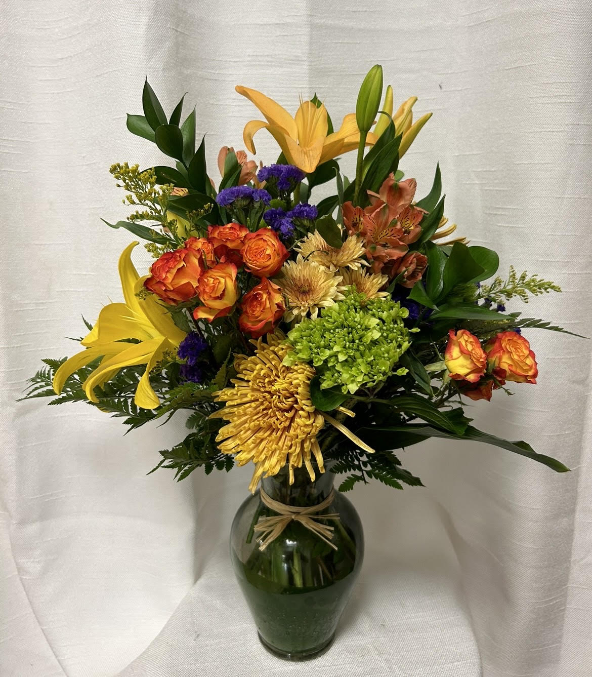 Autumn Glow - As the days get shorter, brighten your home with the Autumn Glow bouquet filled with fresh, greens and vibrant oranges. Remind a friend that the sun is still out, and there's fun left to be had in the fall.
