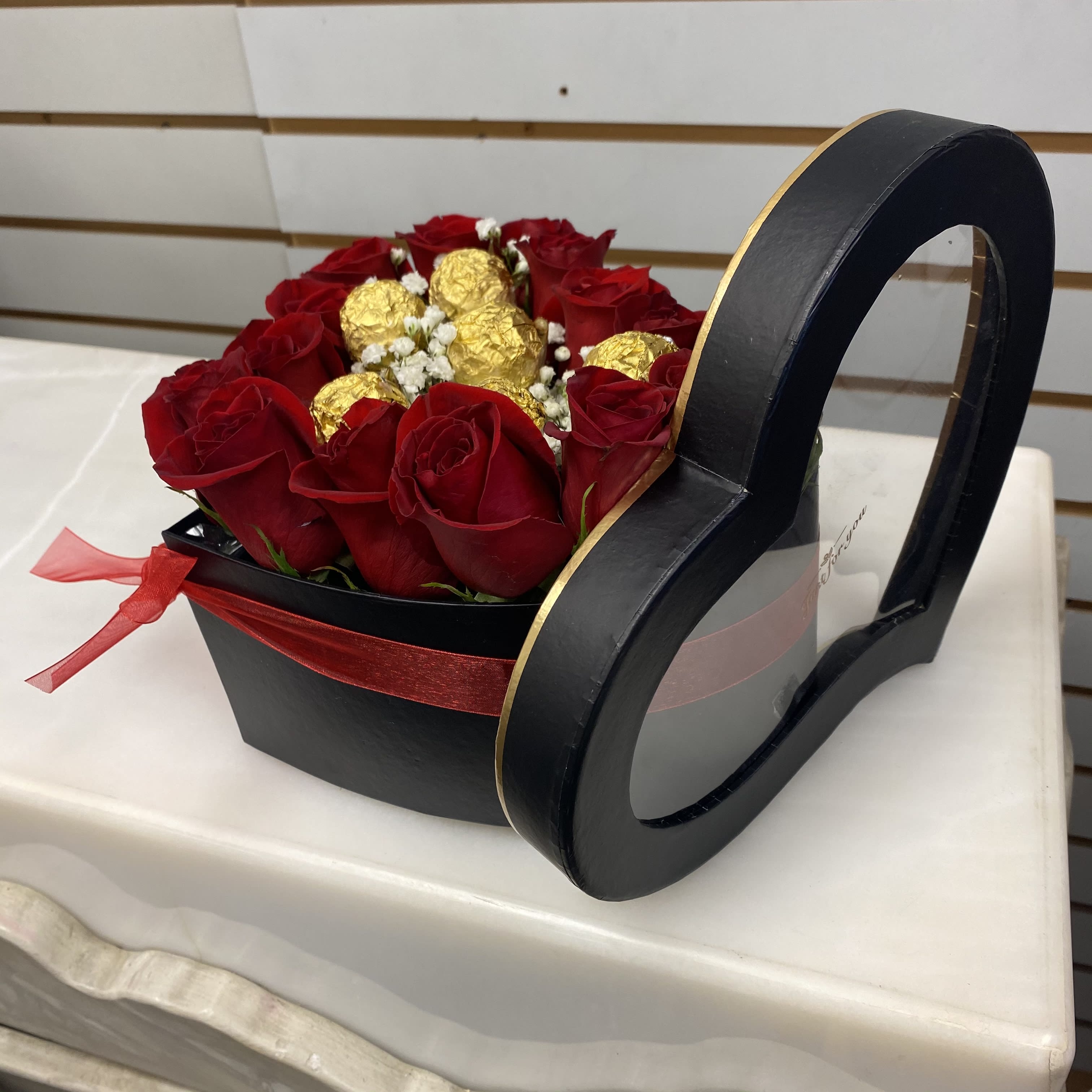Roses in a Heart Box & Chocolates Roses in a Heart Box & Chocolates - Fresh red roses inside a heart box with chocolates, color of the box may vary.