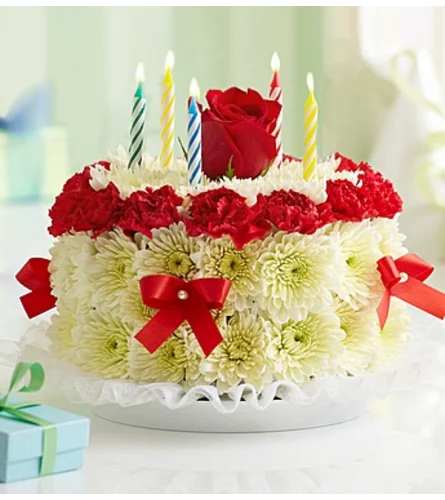 Red Floral Cake Red Floral Cake - a beautiful display of fresh florals expertly designed to look like a cake. Looks good enough to eat!