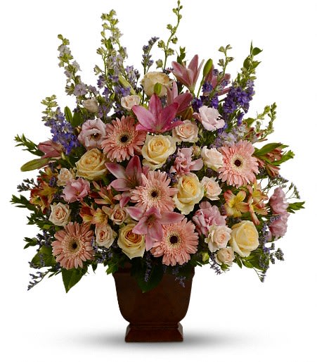 Loving Grace Arrangement Loving Grace Arrangement - A warm and peaceful bounty of pastel blossoms gently expresses love and respect. This gracefully composed arrangement is hand-delivered in the dark and elegant Noble Heritage urn. Approximately 26 inches wide and 30 inches tall.
