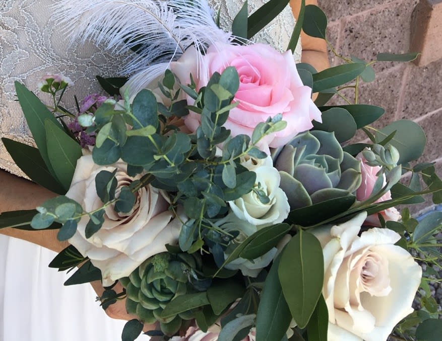 Gracious Garden Bridal Bouquet - Let our designers create this stunning bridal bouquet full of roses, garden roses, succulents, muted greens and lots of texture to match your wedding colors. Premium picture shown. 