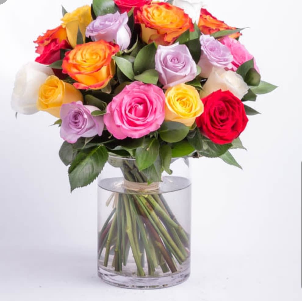 Simple Beauty Simple Beauty - This vibrant colored one dozen roses is hand tied with twine and placed in a clear vase, using a variety of colored roses. Premium version pictured (2 dozen roses).