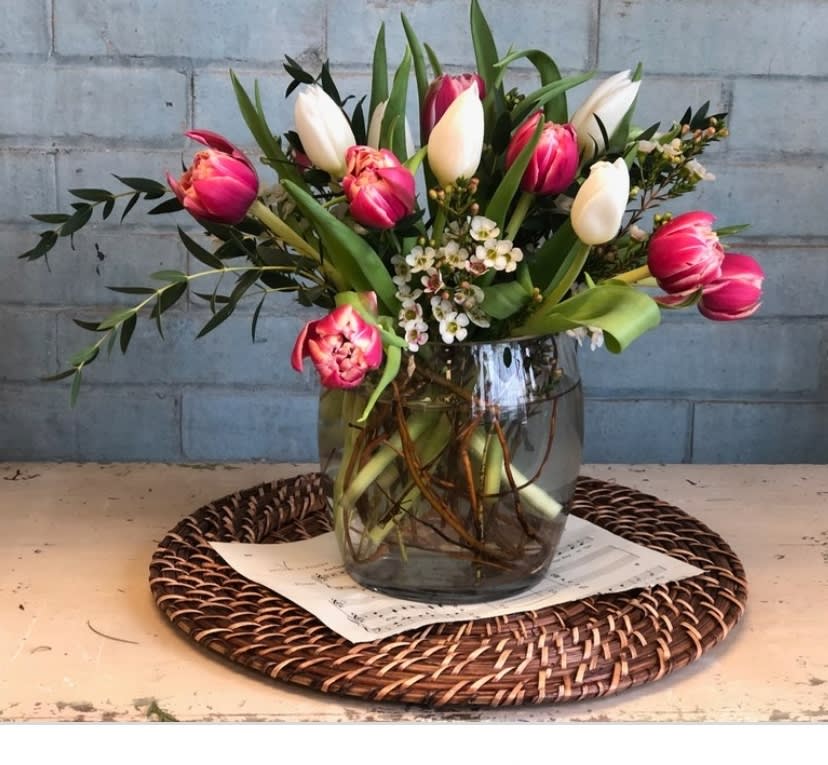 Dancing Tulips Dancing Tulips - Selection of colored tulips arranged beautifully with lush greens and filler for that special woman.