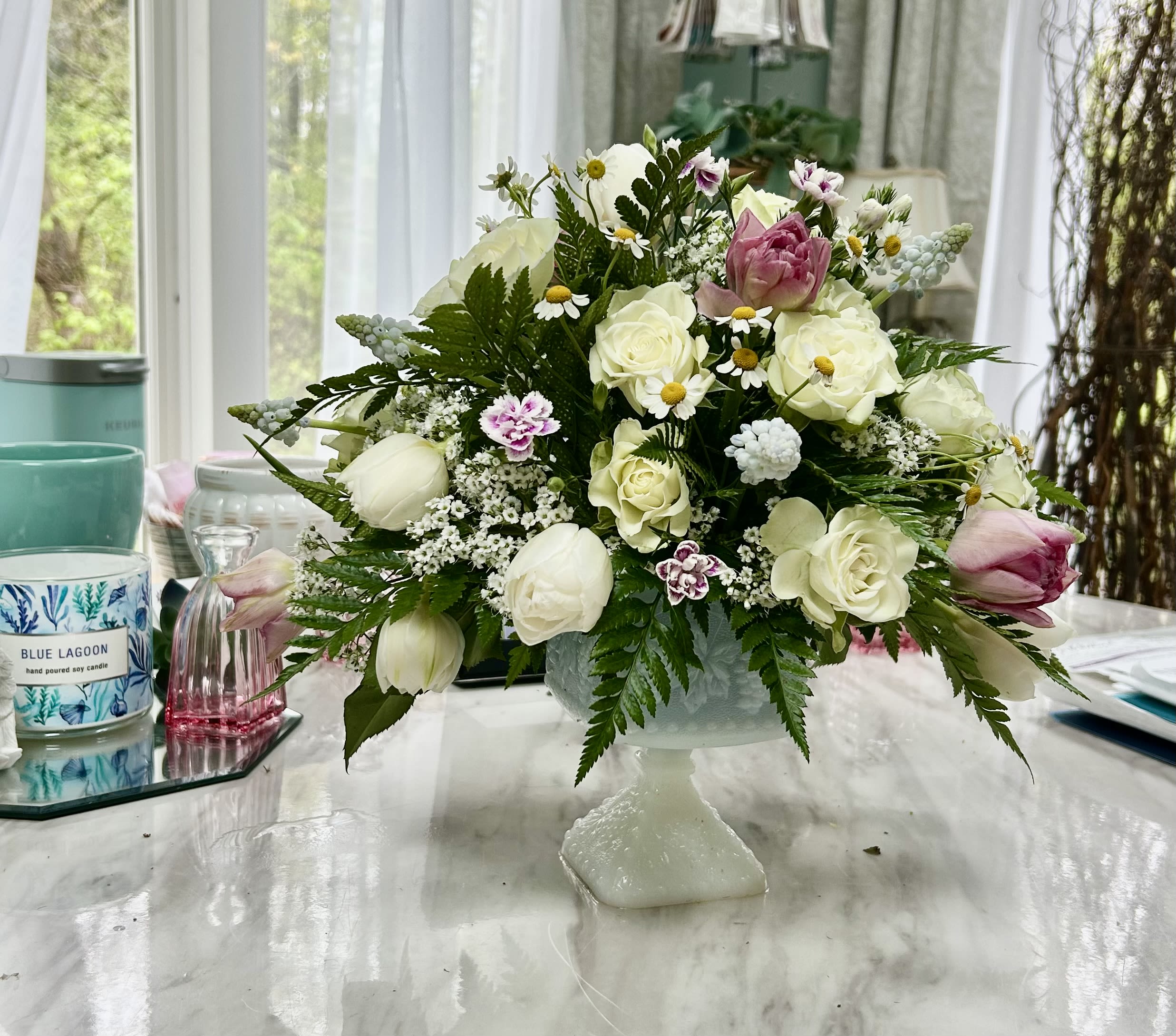 Precious moments - White roses, spray roses, pink tulips, wax flower in a pedestal