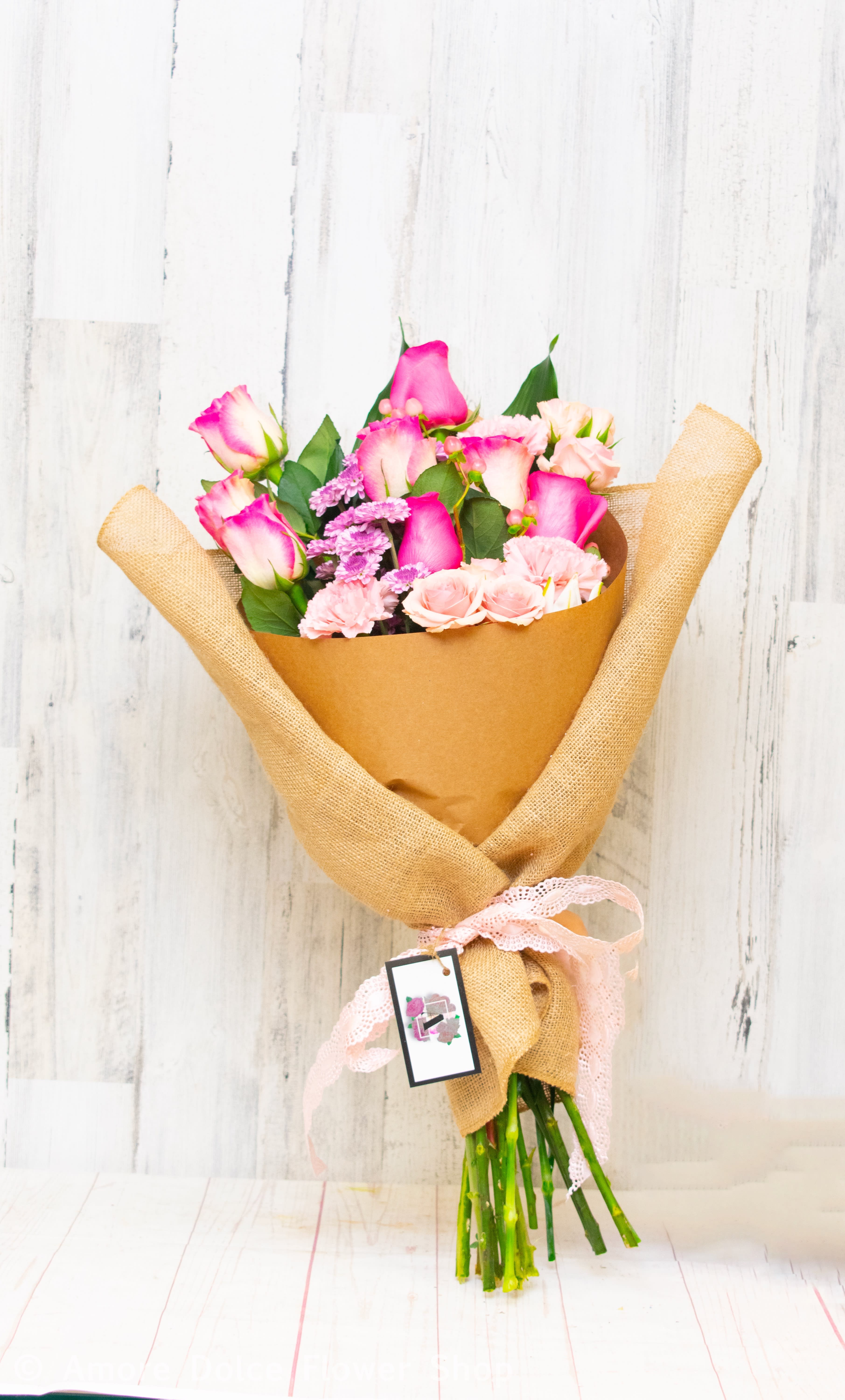Amore   Bouquet  -  Here’s an Instagram caption you can   Simple, elegant, and wrapped in love! This charming bouquet of pink roses and carnations is the perfect way to brighten someone’s day or make a sweet gesture. Whether it’s for a birthday, anniversary, or just because—this arrangement from **Amore Dolce Flowers** brings joy with every bloom.  Wrapped in natural burlap and finished with a delicate bow, it’s a beautiful reminder that love and thoughtfulness are always in style.   #AmoreDolceFlowers #BouquetOfTheDay #PinkPerfection #FloralDesign #FlowersForEveryOccasion #BouquetLove #BloomWithGrace     Custom wrapped bouquet by Amore  ( Due to limited availability, rose colors will vary from photo)                                  Flower delivery montebello ,Whittier,Pasadena,Downey,Pico Rivera,la habra,downtown 