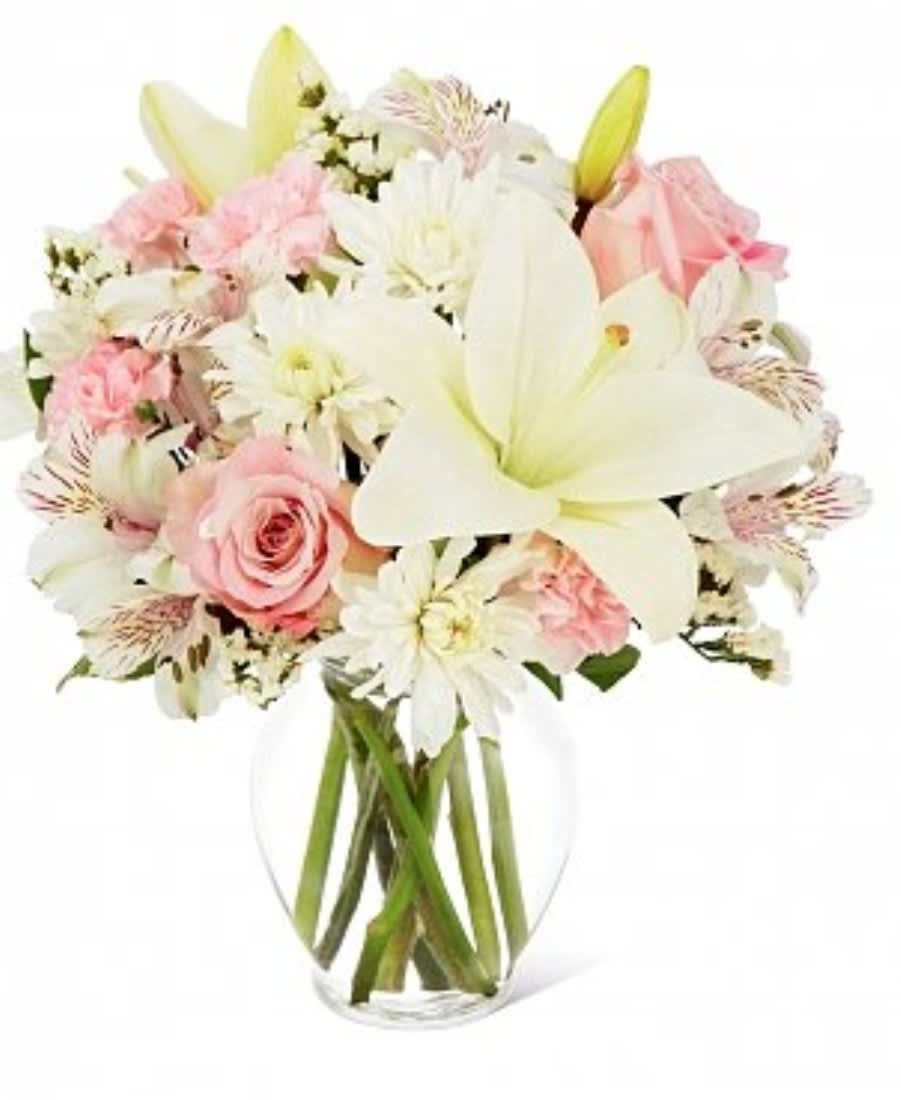 Pleasant Pastels Pleasant Pastels - A wonderful bouquet of white lilies, pale pink roses, white daisies and pale pink carnations created in a simple but stunning design.
