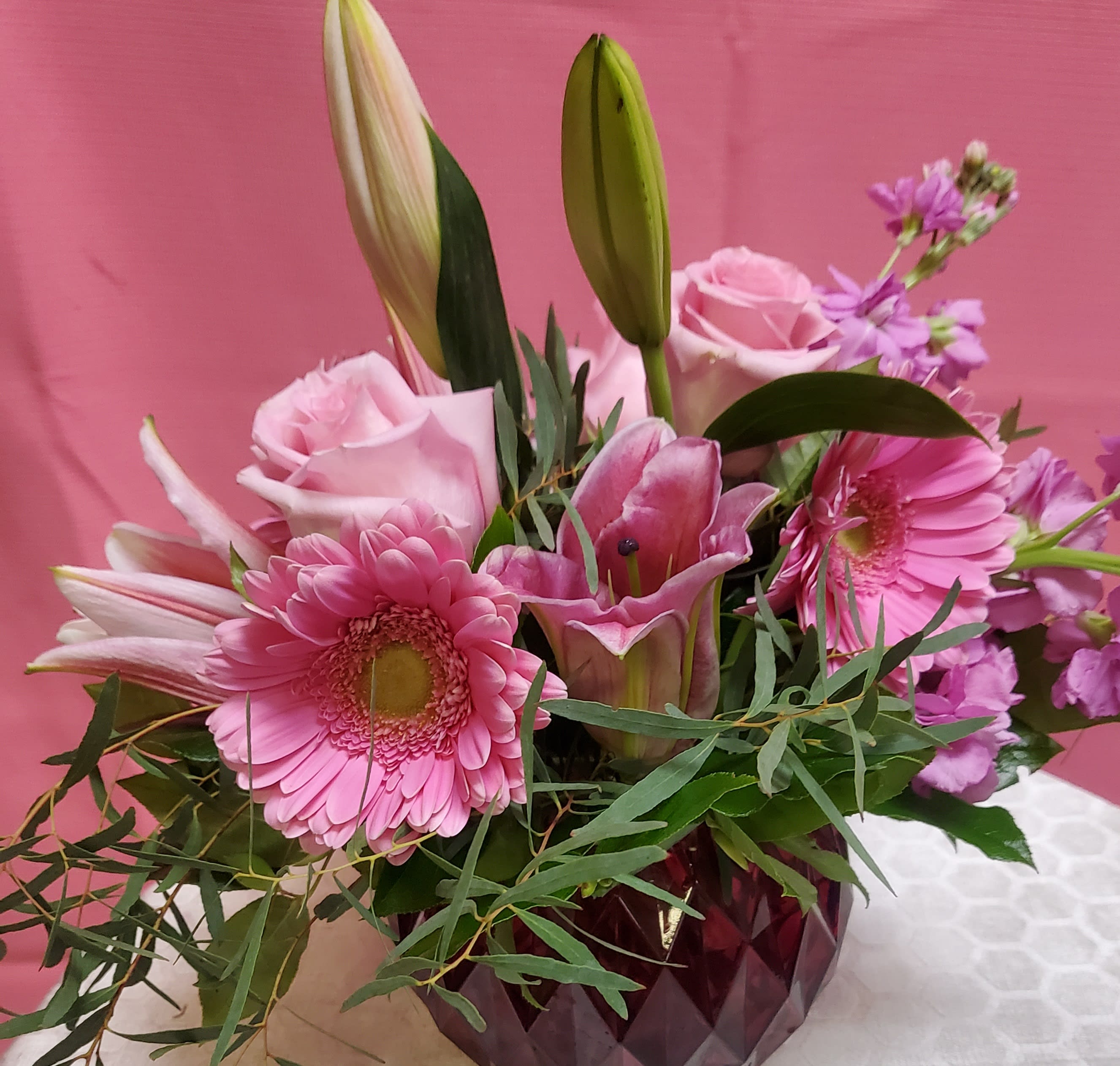 Pretty in Pink Pretty in Pink - This beautiful arrangement of roses, gerbera daisies and succulents is the perfect way to show your love to her or just surprise her with a smile!