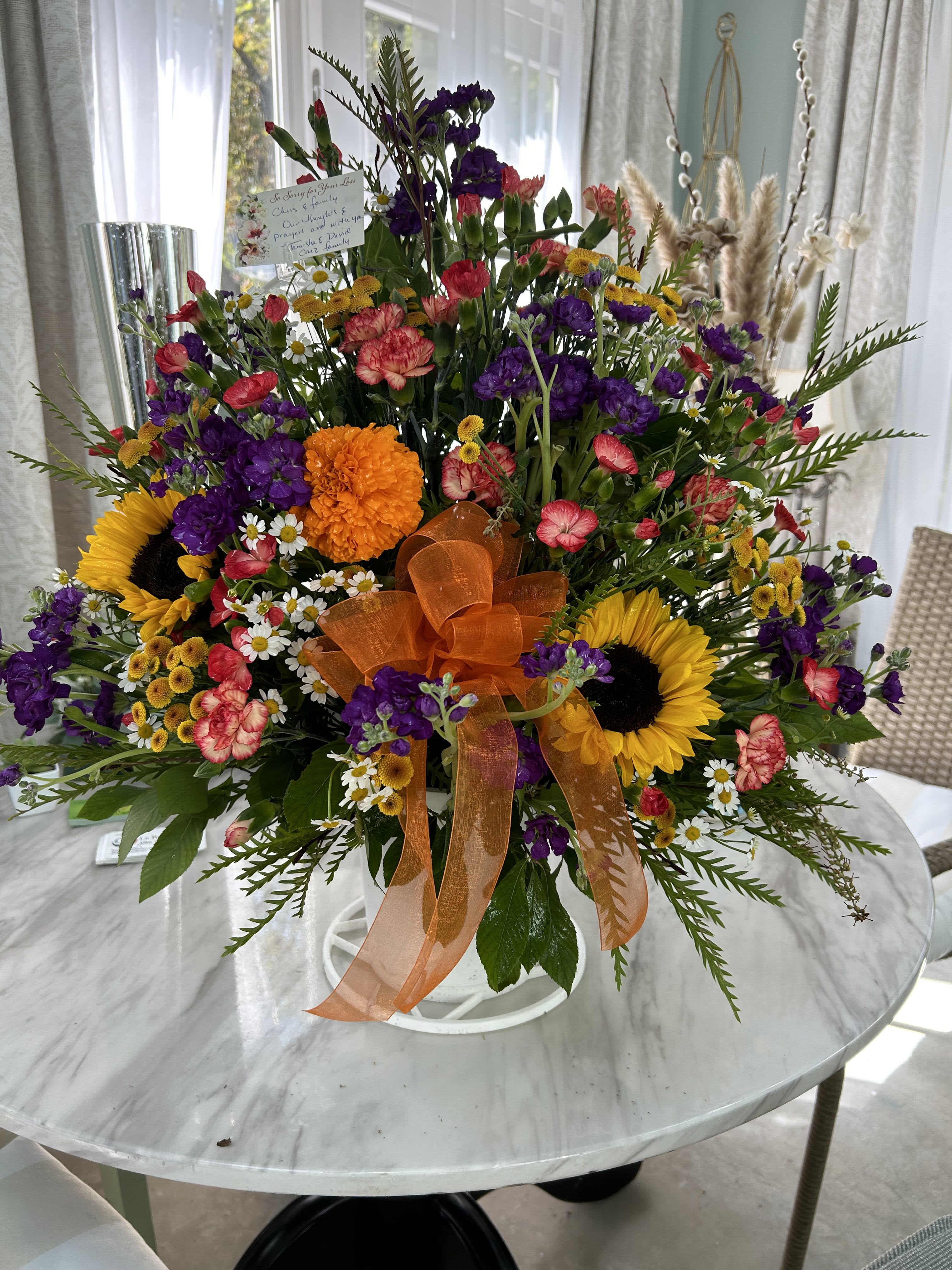 Summer splendor - A beautiful mix of summer blooms, including marigolds, sunflowers, and more.