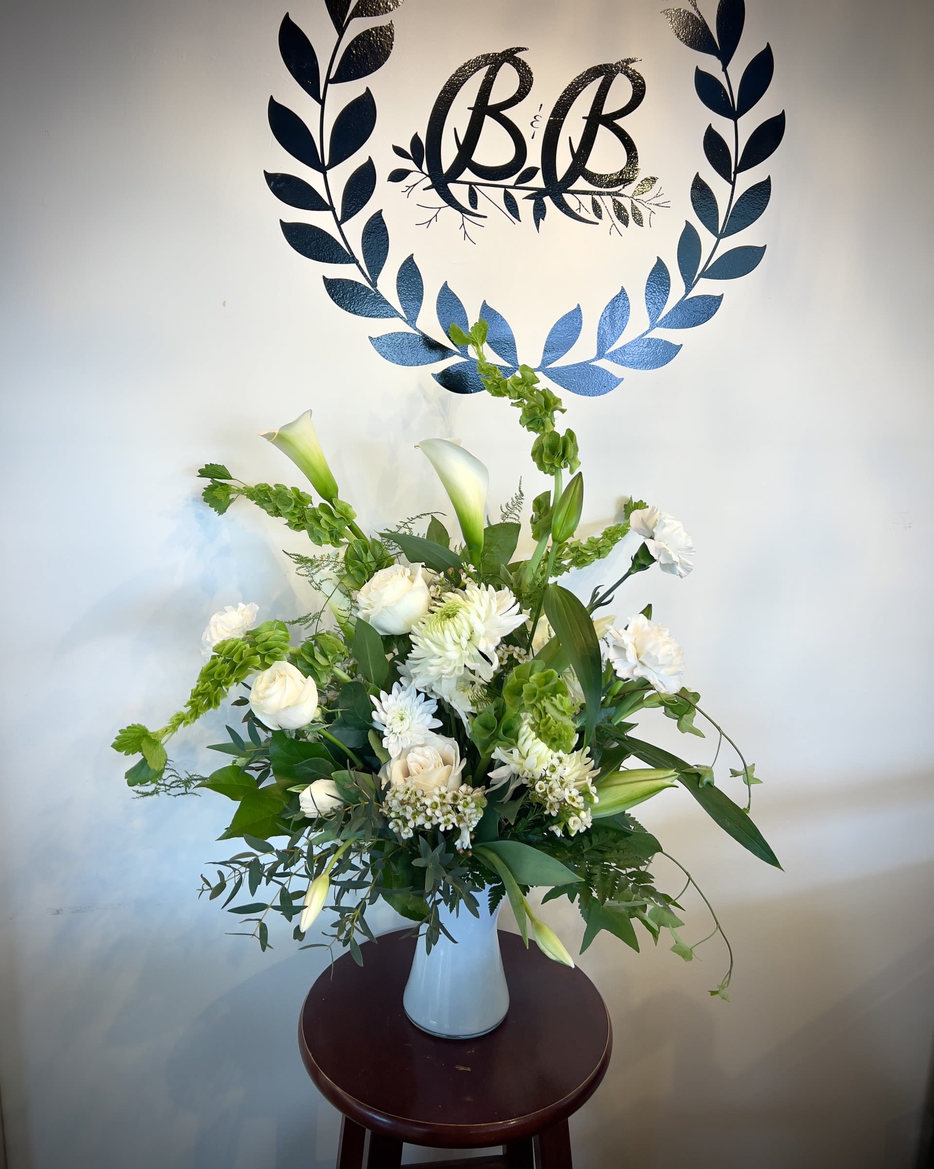 White and Wild White and Wild - Add some wild fun to any day with the arrangement "White and Wild". This arrangement incorporates quality garden blooms and greenery to give a natural feel to any room. *Please Order ahead if you would like a change in colour.