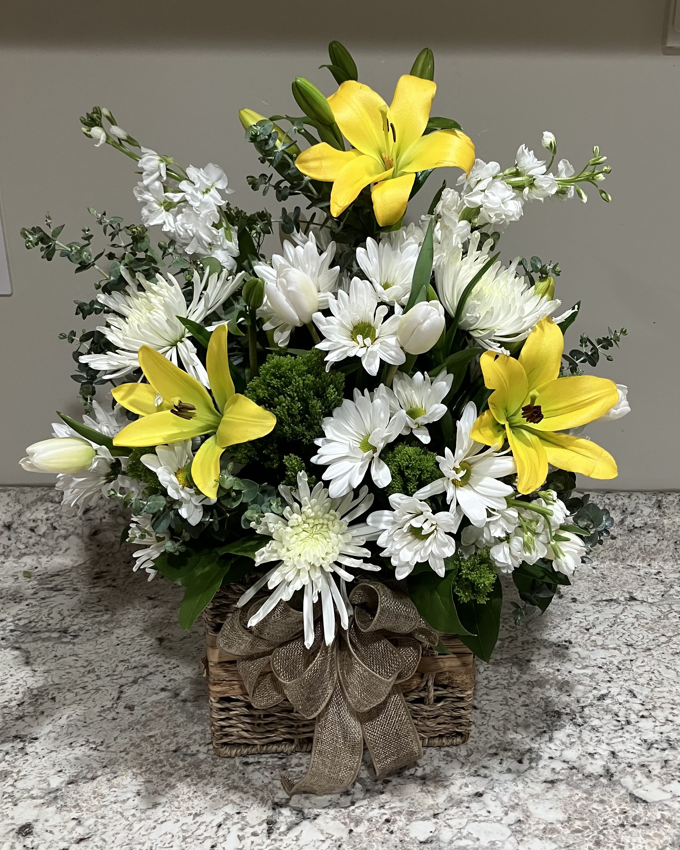 Busy Bee Basket - A cute basket of yellow Lilies and white Daisies.