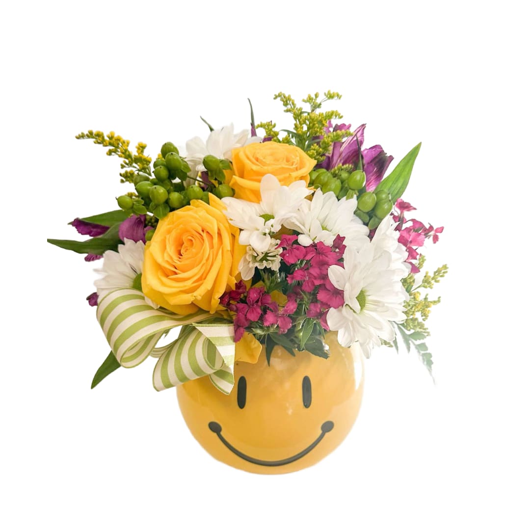 Make em' Smile Make em' Smile - This bouquet is full of bright colors of seasonal blooms with out signature ribbon.