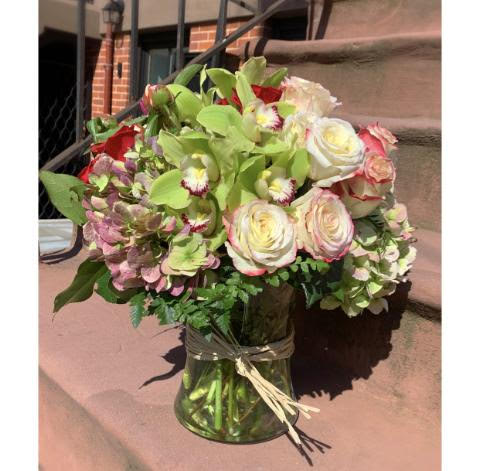 Sophisticated Beauty Sophisticated Beauty - Hydrangea, roses, and orchids in a clear case.