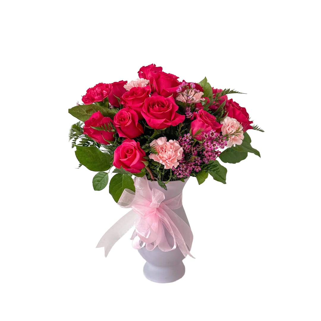 Pink Petals - This is a large vase of flowers and is filled with 1 dozen pink roses, pink carnations and wax flower!   **Please not the shades of pink may vary