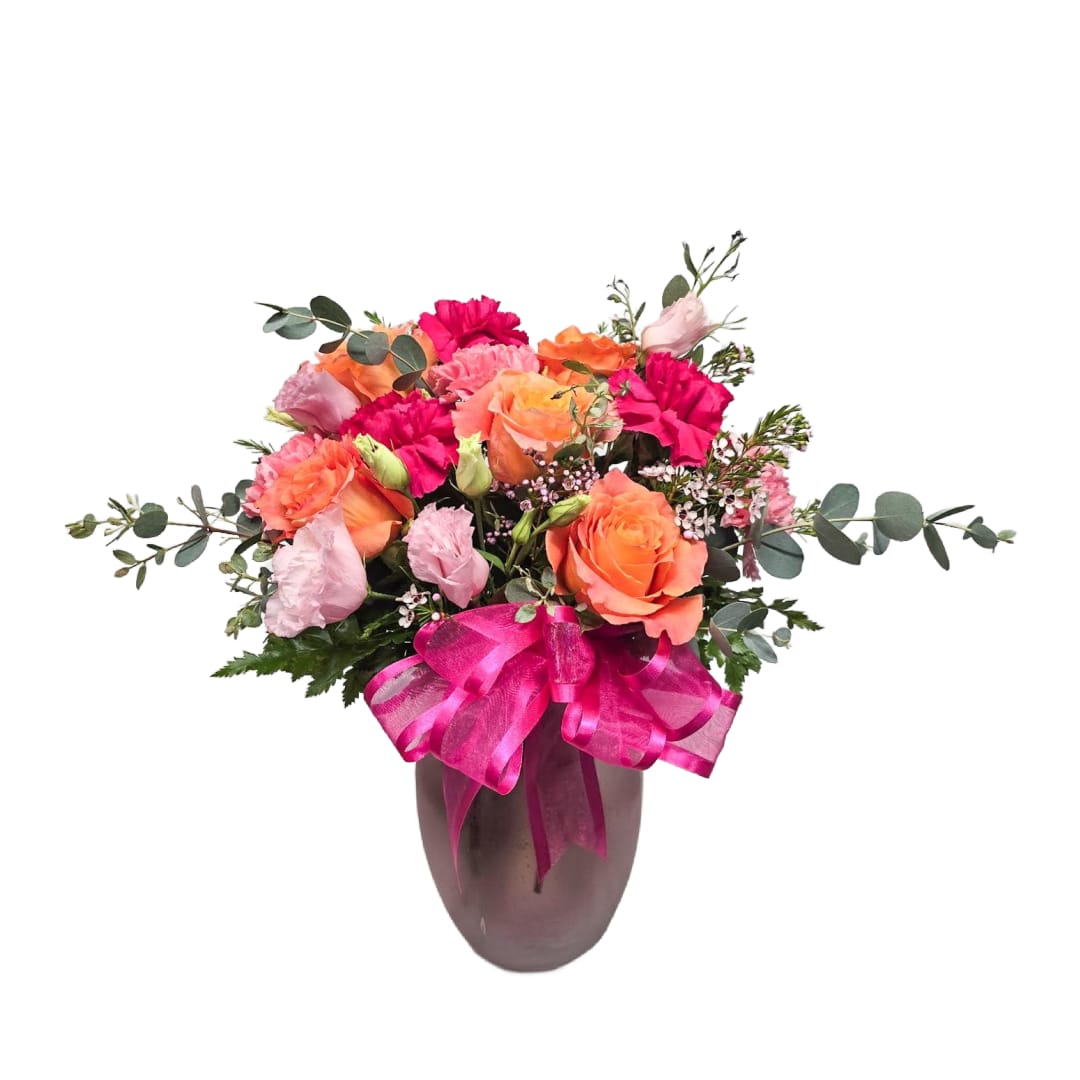 Life of the Party by BloomNation Life of the Party by BloomNation - Celebrate good times with this vibrant bouquet. The arrangement is orange and pink with roses, carnations, and other seasonal blooms. Vase style and color may vary.