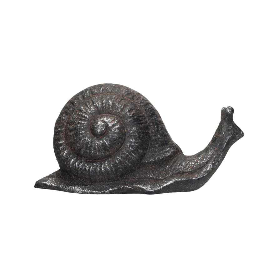 Brass Snail  - This cast iron snail with rust finish is a delightful accent decor for any home. It brings a touch of whimsy and nature to any space with its snail shape that has a spiral shell and antennae. The cast iron material is sturdy and long-lasting, and the rust finish gives it a vintage and natural look. The snail can fit any style, from farmhouse to coastal to cottage-core. It can also be used indoors or outdoors, such as on a shelf, a table, a garden, or a patio. It is easy to keep clean and tidy, and it will make any space more charming and cozy. The snail decor is suitable for any space.