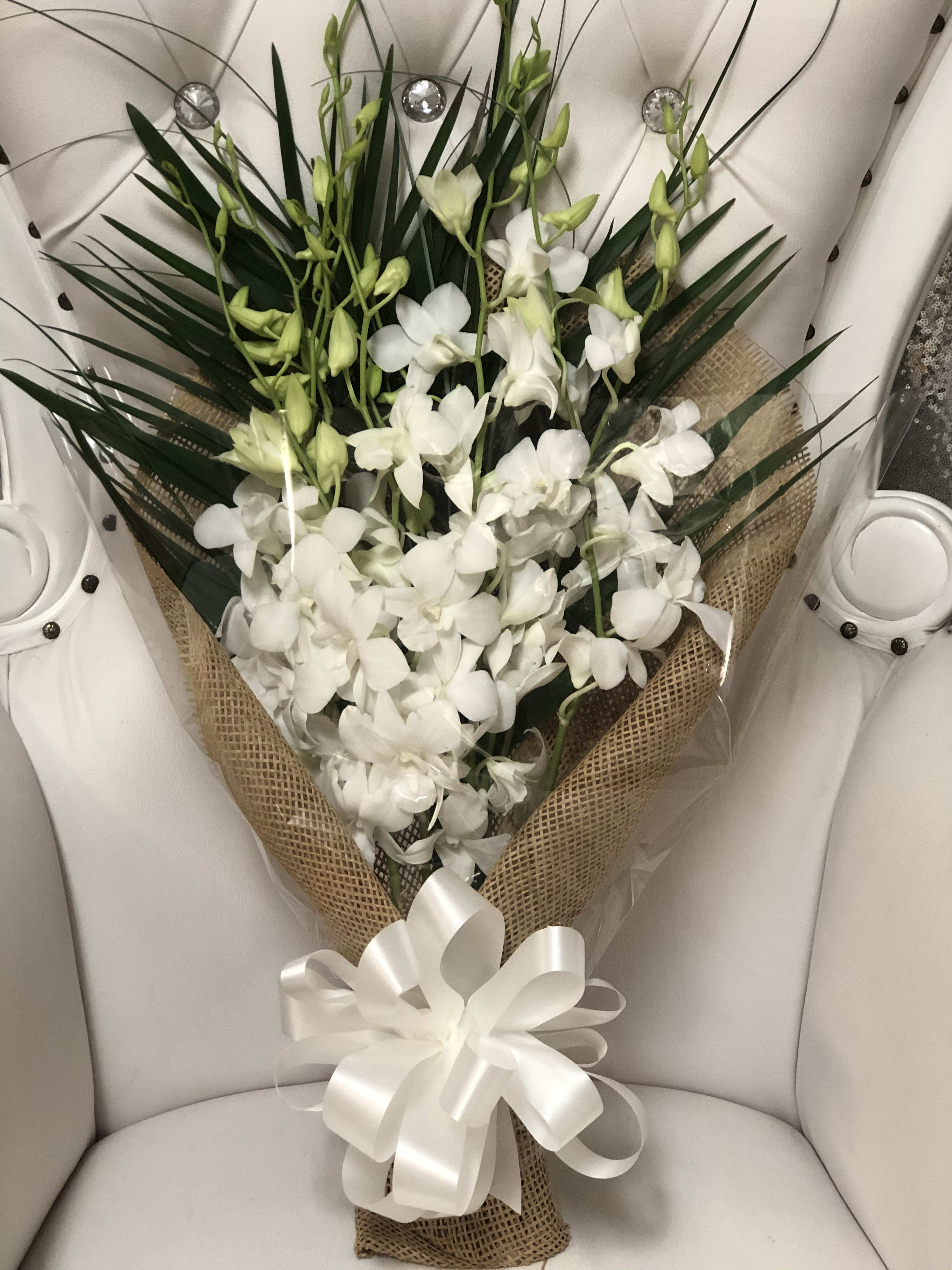 Wrapped Orchids with Palms Wrapped Orchids with Palms - 10 white orchid and green palm with greenery . Available in pink , purple(include in special instructions).