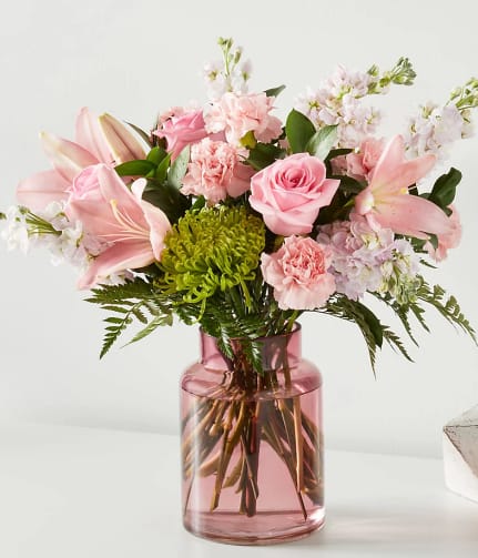 Pretty in Pink Blooms - Assorted pink blooms in a pink vase. 
