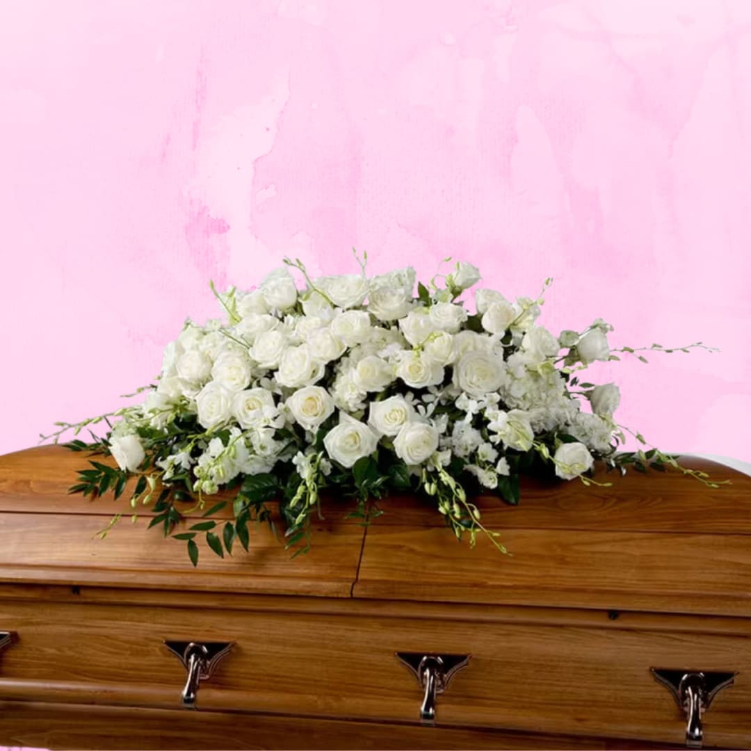 Tranquility by BloomNation™ Tranquility by BloomNation™ - An all white tribute, this full casket spray is pure and tranquil. Featuring a variety of white flowers and greenery, this elegant spray evokes a feeling of peace.