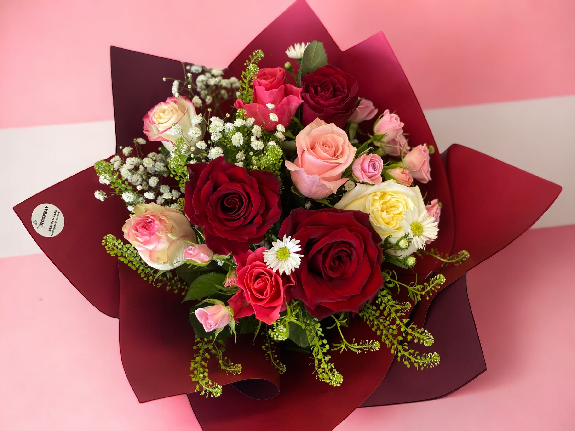 Roses bouquet - A bouquet of 6 roses and spray roses for any occasions. Deluxe is 12 roses. Premium is 18 roses. **Color of roses/wrapping style and designs may vary**Note in Florist Instructions for special request**  We offer different colors and styles for wrapping paper. Please note in Florist Instructions your choice of wrapping paper. We have one solid color like red, pink, white, classic brown, clear, etc. We also have two side colors like white/gold, light pink/hot pink, pink/purple, blue/white etc. And lastly, we have them in shiny/iridescent colors, or texture/style paper. Call us at 323-961-6686 if you have any questions.
