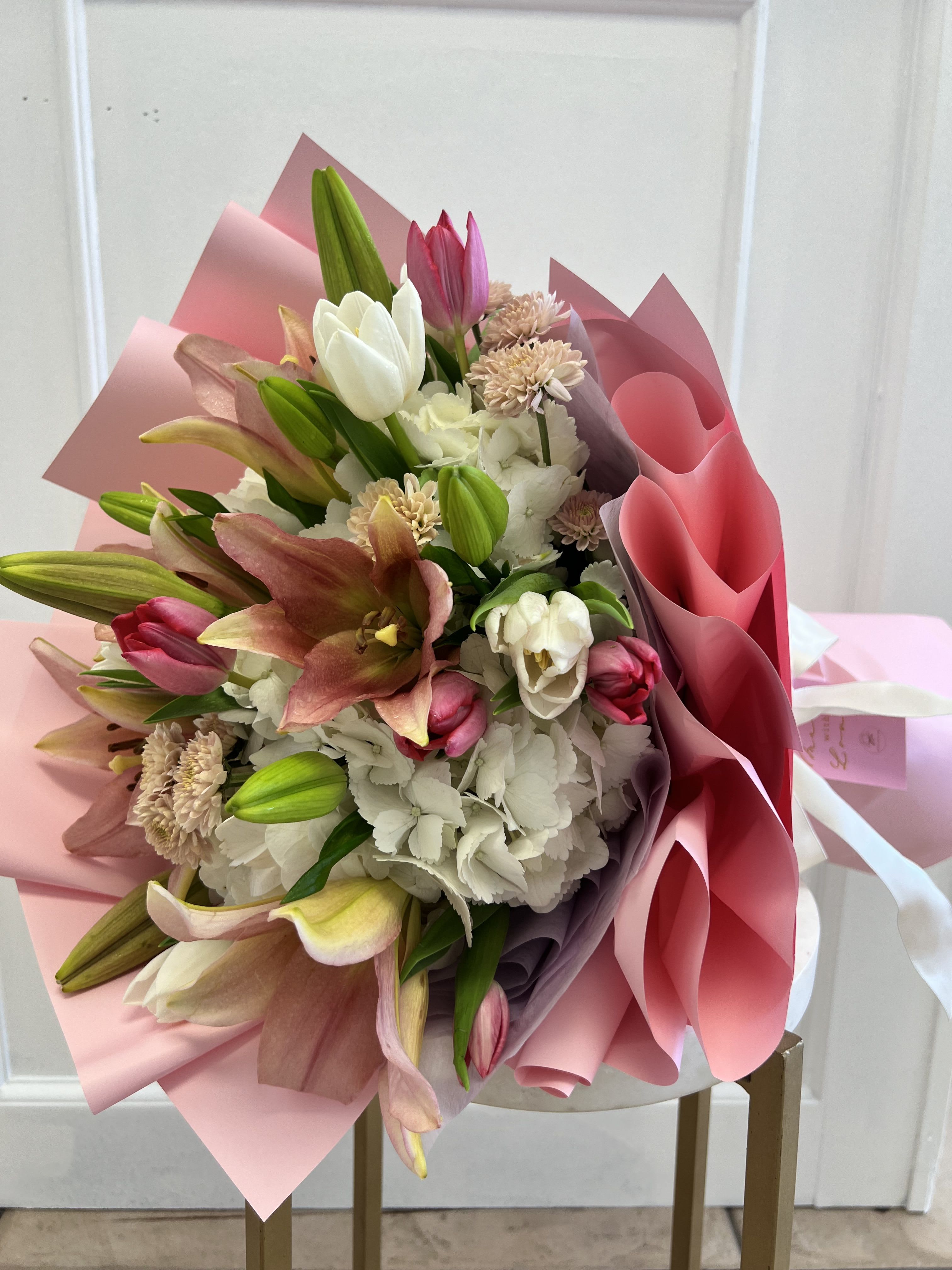 Lili Bouquet  - If your loved one loves lilies this is the bouquet! Perfect for Mother’s Day or birthdays. Carefully made with pink lilies, tulips and white hydrangeas. Wrapped with waterproof paper. 