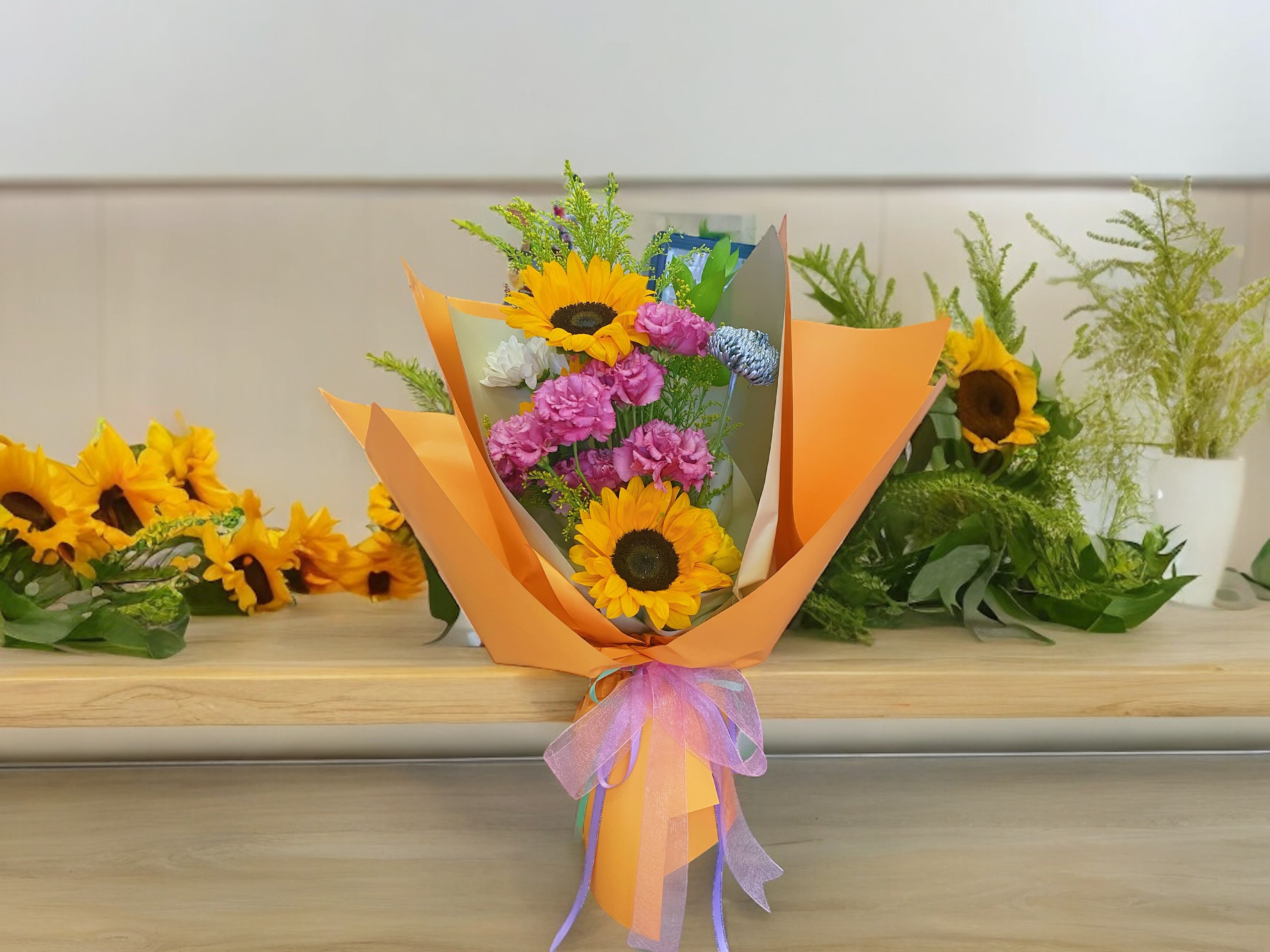 Two Sunflowers Bouquet Two Sunflowers Bouquet - Two Sunflowers with foliage.