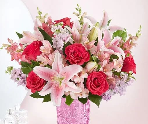 Spring Embrace - a unique selections of spring flowers roses lilies  This selection will be the highlight to anyone's day