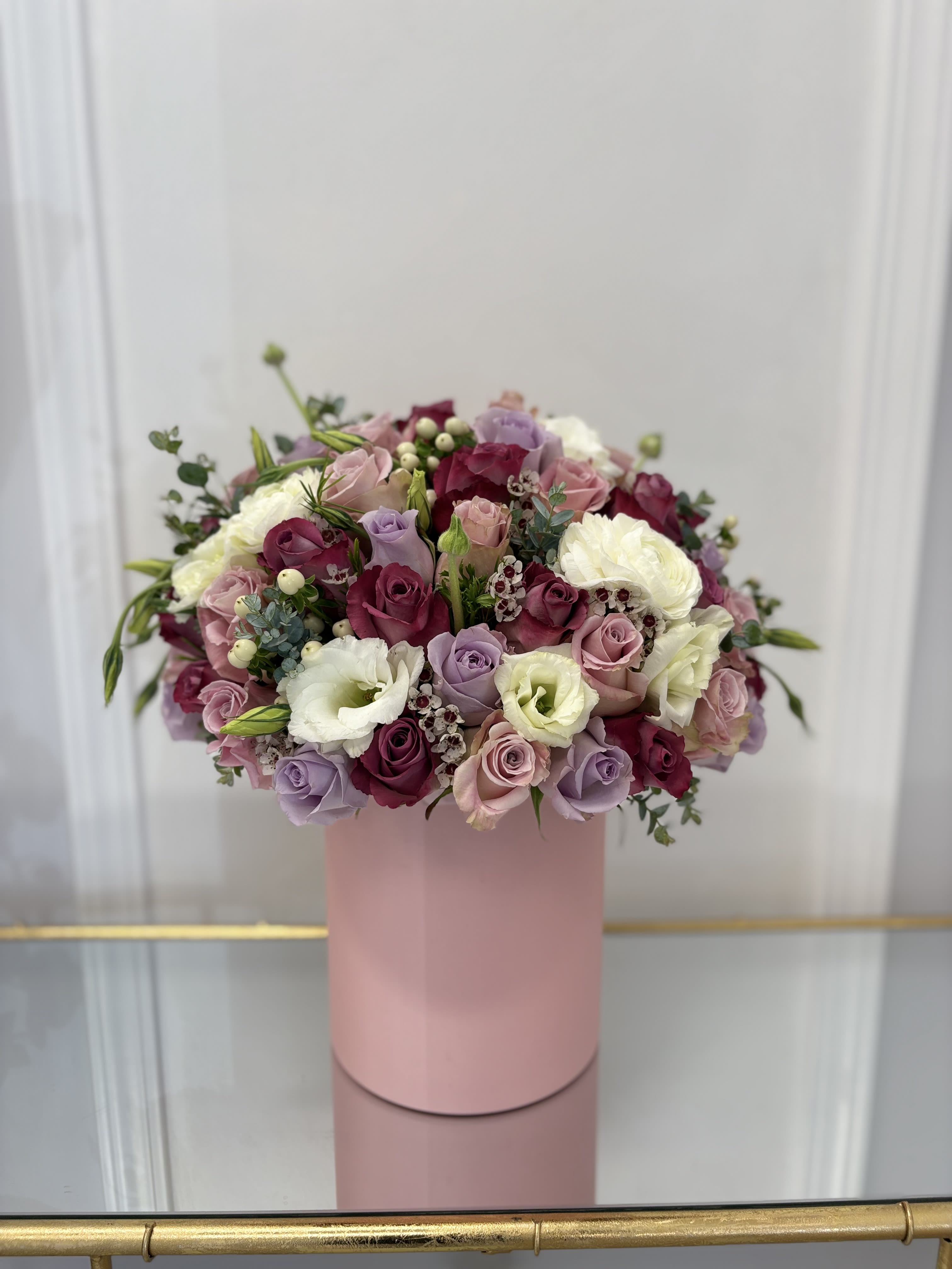 Sweet garden Hat Box By VLM Flowers - A perfect combination of white, pink, lavender, and purple in one composition. 