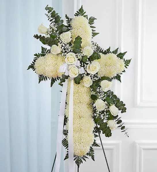 Peace &amp; Prayers White Standing Cross - Standing cross arrangement of white football mums and roses; accented with baby’s breath and soft, lush greenery 