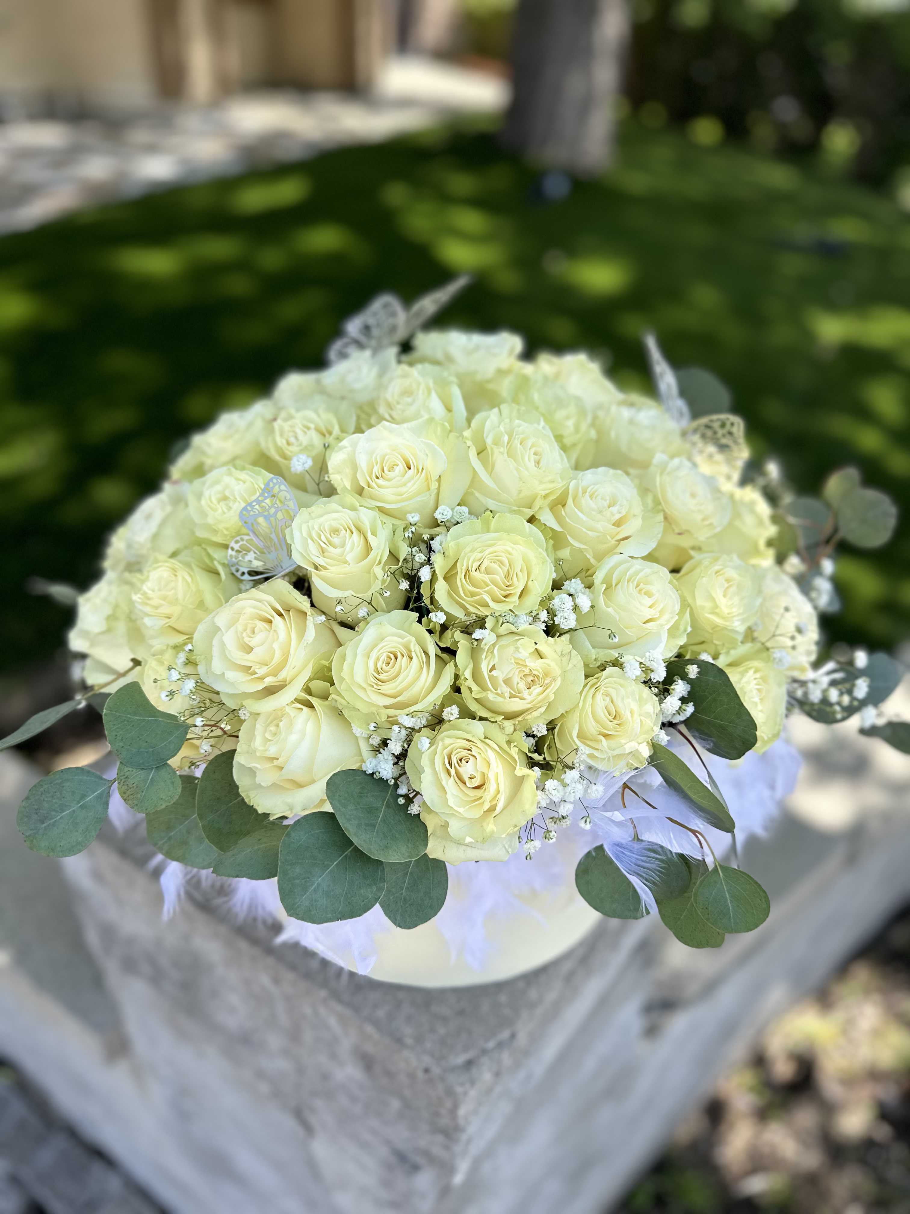 Velvet Petals - Purity, sincerity, and grace — all embodied in each white rose. This arrangement of 50 flawless blooms in a stylish box is more than a gift; it's an elegant expression of the most heartfelt emotions.  White roses speak of deep respect, unspoken love, and beauty in its purest form. A timeless gesture of elegance and meaning.