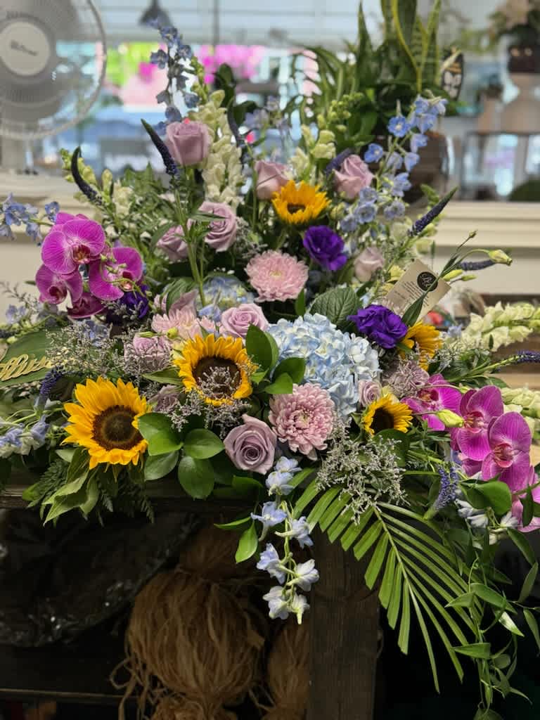 Saying Goodbye Saying Goodbye - Container oasis with beautiful mixed flowers and colours,