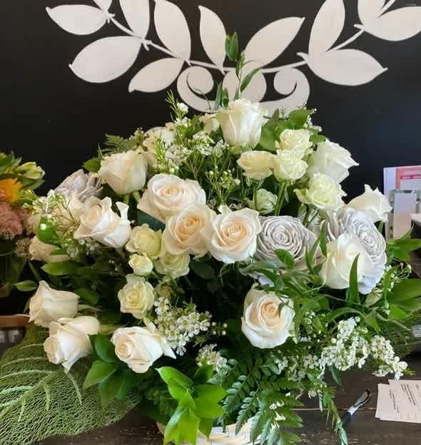 Did Someone Say Roses - A beautiful display of real and wooden roses in a ceramic container