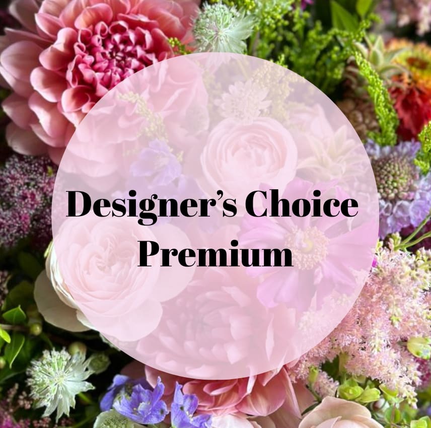  Premium Designer's Choice Arrangement - Let our florists work their magic with this stunning Designer’s Choice Deluxe Arrangement. Handcrafted with the freshest, most beautiful blooms of the day, this arrangement is a one-of-a-kind creation tailored to highlight seasonal colors, textures, and natural beauty. Perfect for any occasion—from birthdays and anniversaries to just-because gestures—this deluxe version offers a lush, fuller presentation for extra impact and elegance. Trust our expert design team to create something unforgettable.  In rare cases of extremely high demand (such as major floral holidays), substitutions may be made using available fresh products. This could include plants, orchids, or curated gift baskets, always of equal or greater value and beauty. Rest assured, our priority is delivering something special, thoughtfully arranged with the same care and quality you expect from us.