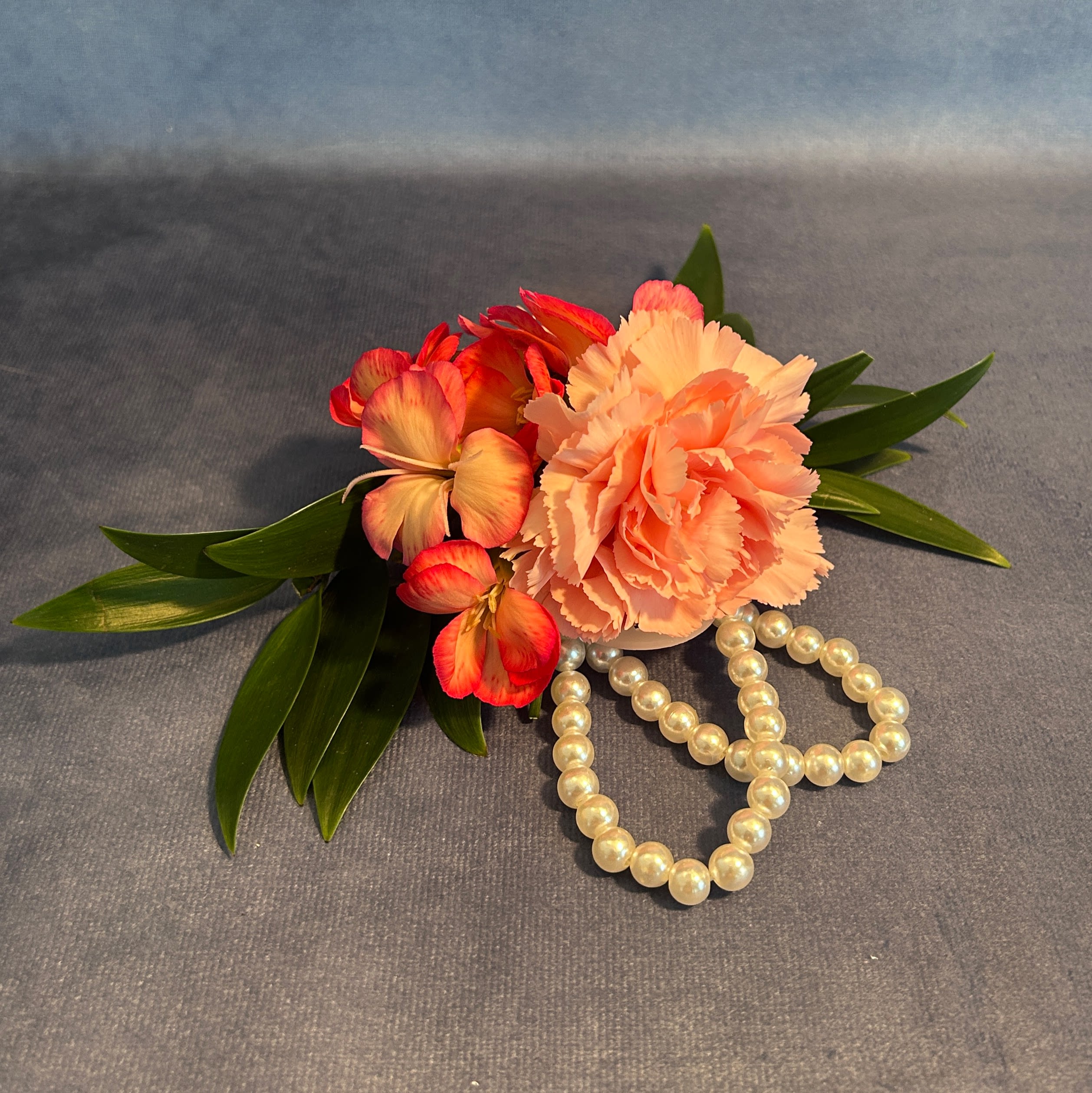 Slice of Paradise Corsage - Add a splash of tropical color to your outfit with this eye-catching combination of carnations and dianthus blooms!