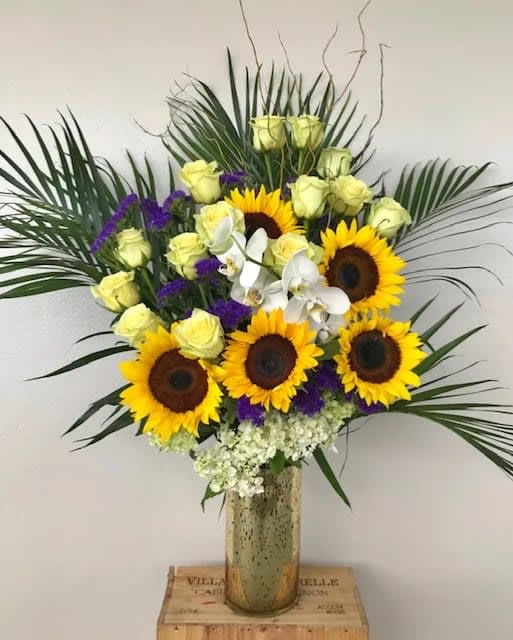 Magnificent Five Magnificent Five - Sunflowers, Orchid blooms, green in golden glass vase.