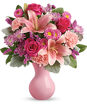 Teleflora's Lush Blush Bouquet TEV45-2A - Make them blush! From the shapely grace of our exclusive pink Serendipity vase, to the lush bouquet of roses, lilies and carnations that it holds, this special treat is a grand gift for any occasion, or just because! Delivered in Teleflora's pink Serendipity vase. One-Sided 