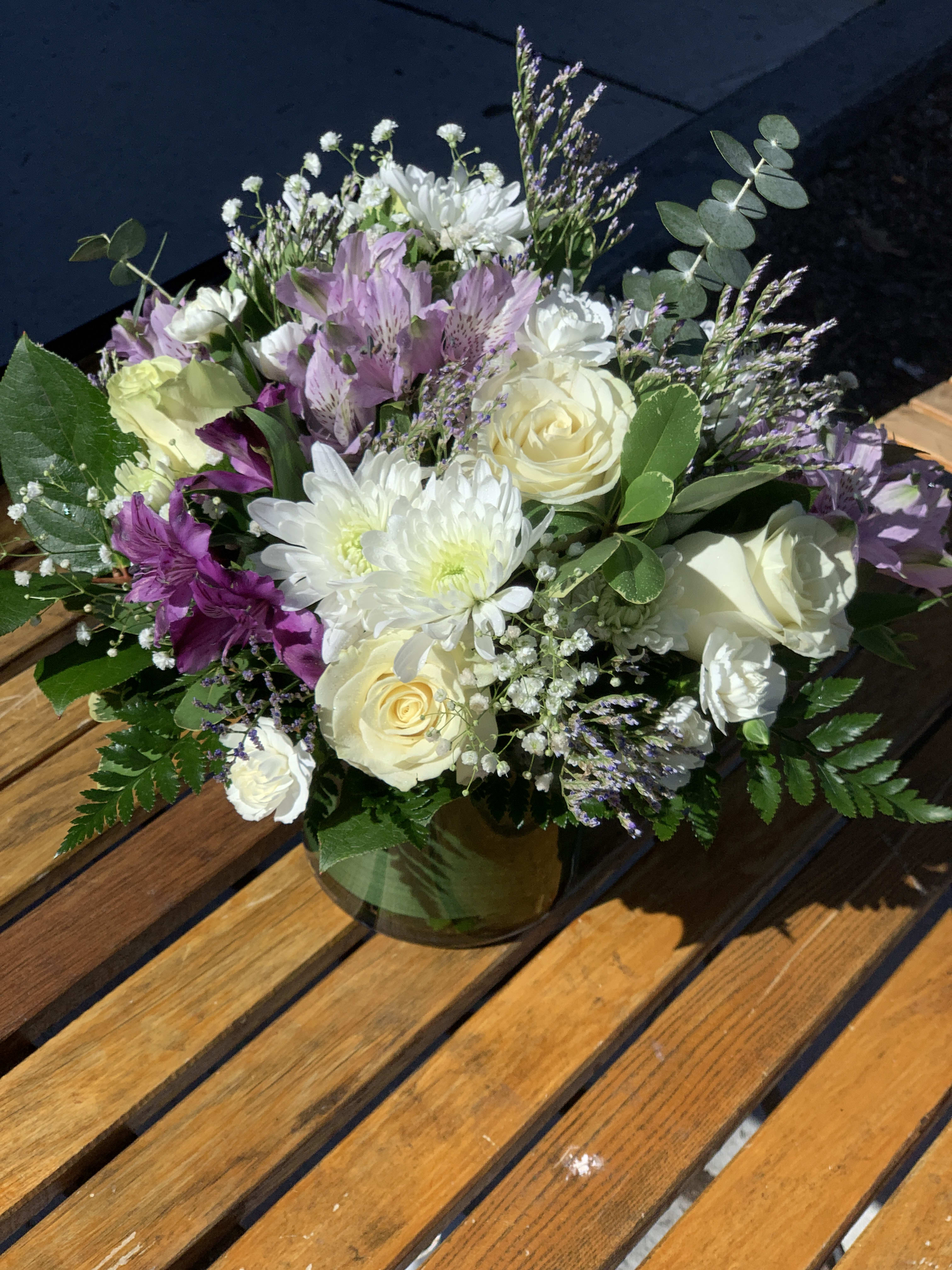 Lovely Lavender "CUSTOMER FAVORITE" Lovely Lavender "CUSTOMER FAVORITE" - Charming lavender flower bouquet is loosely gathered with a medley of lavender & white blooms. Photo is a representation of the bouquet. We will design a similar arrangement based on our current fresh inventory.