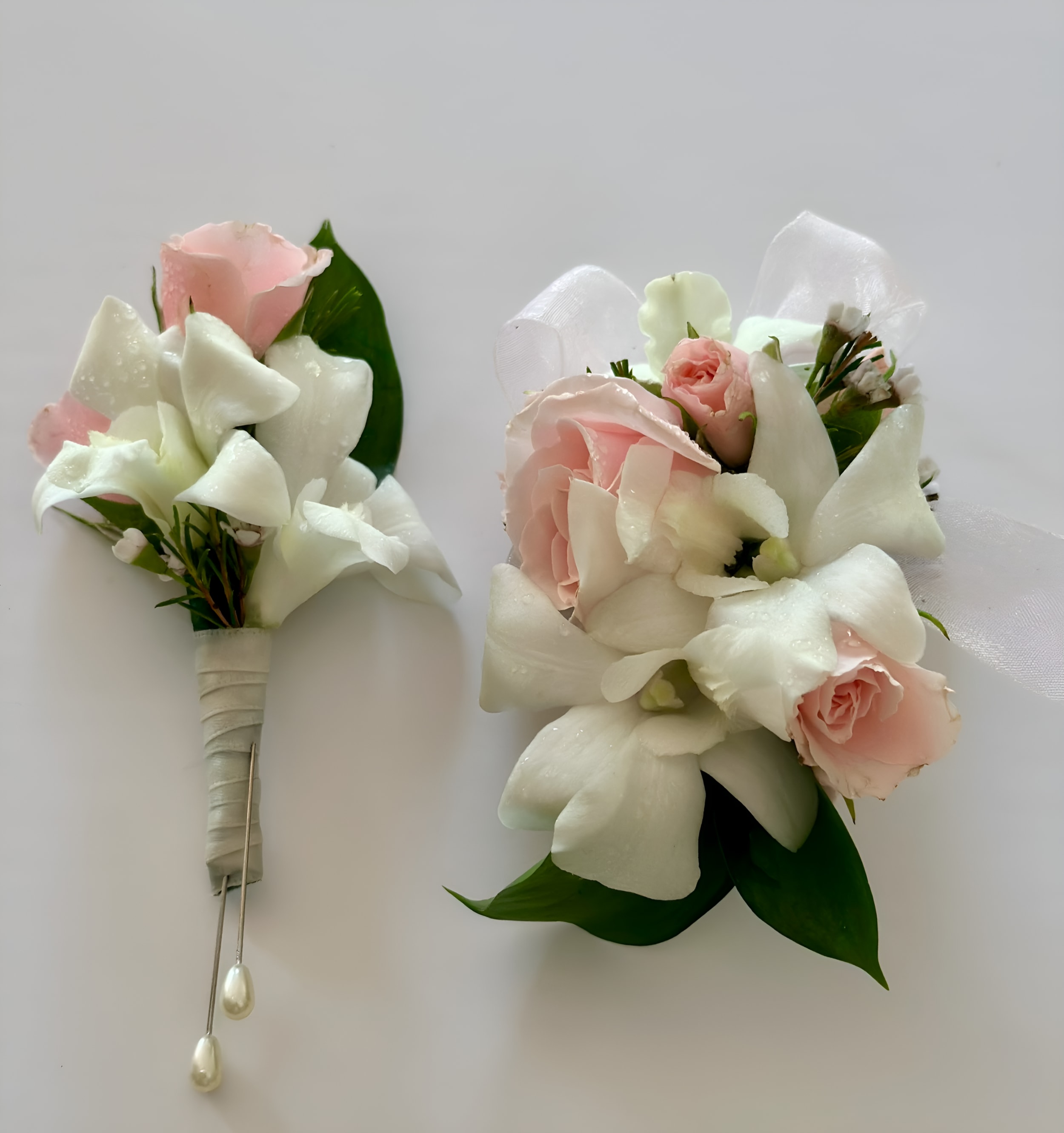 Cool White - Set of Corsage and Boutonniere include white dendrobium orchids and pink spray roses.
