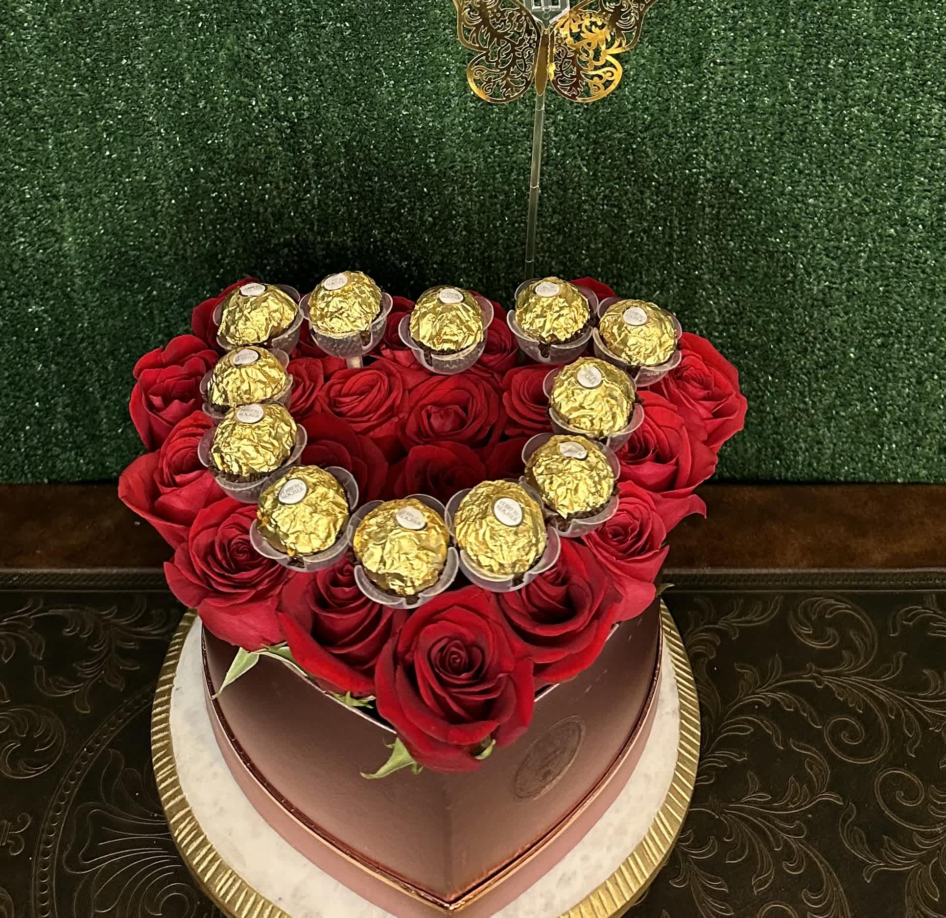 Full heart Full heart - Fresh roses with chocolates on a heart shaped box "Picture is a reference every arrangement would not be exactly the same. Color Substitution may apply. Flowers and color substitution may apply"
