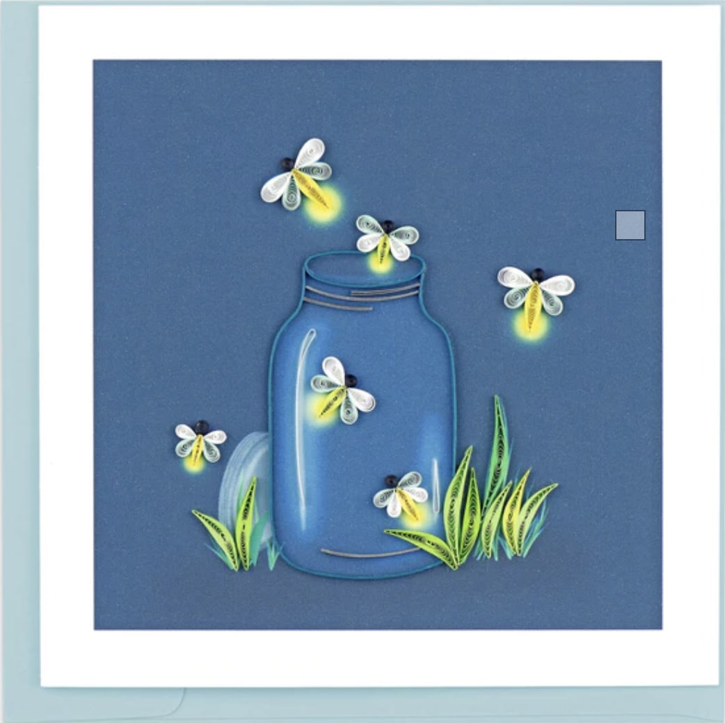 Fireflies Greeting Card - Send this beautiful quilled Fireflies Greeting Card to a loved one for any occasion! Many people treasure memories of catching fireflies as kids. A nostalgic act associated with warm summer nights.The design includes a mason jar filled with quilled fireflies sitting in a small patch of grass on a printed background of dark blue. Outside Copy: Blank Inside Copy: Blank plus additional blank insert to write your own message on Size: 6 in. x 6 in. Envelope Color: Blue 