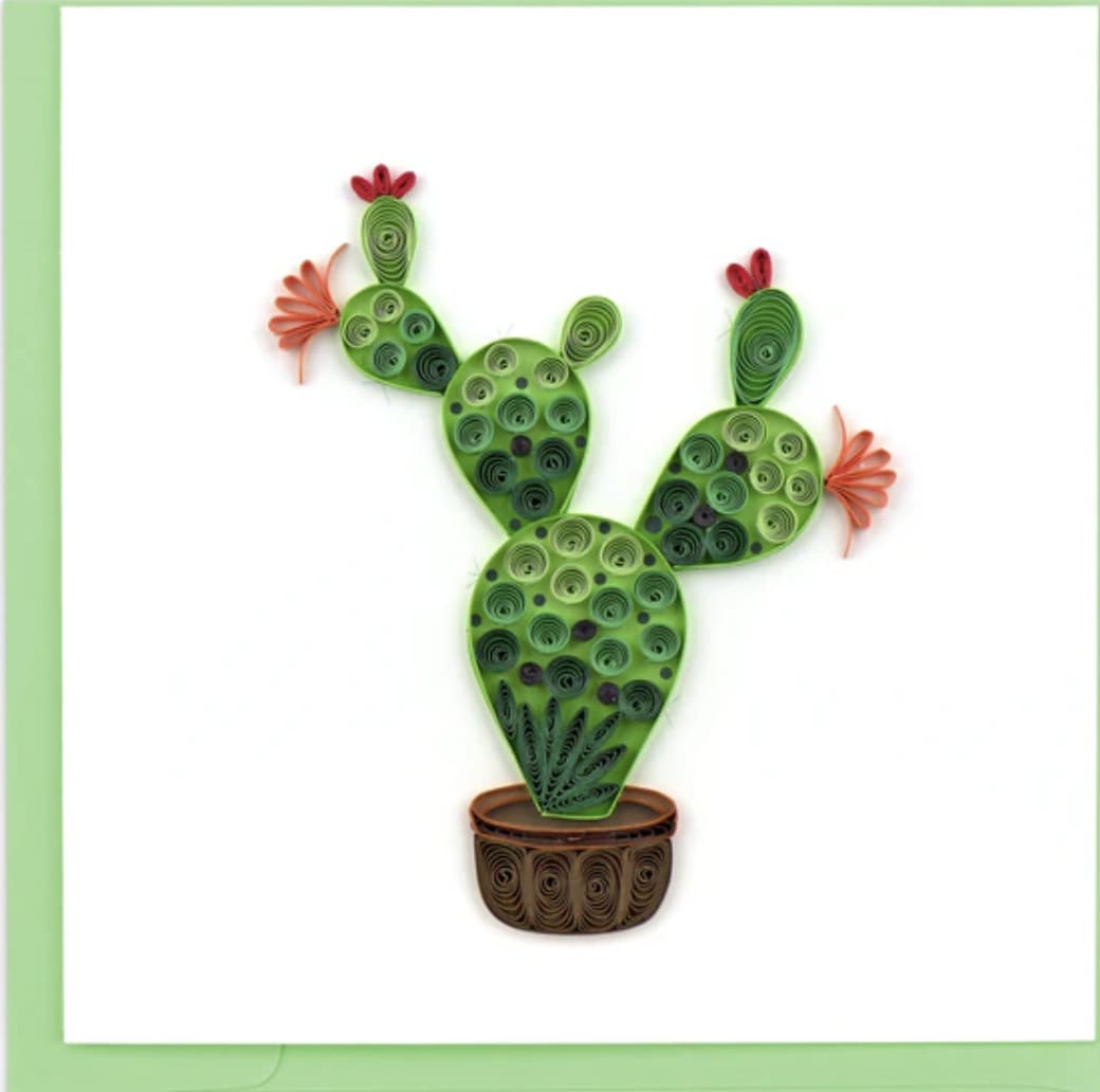 Prickly Pear Cactus Card - Beware of this Prickly Pear, you wont get pricked but might get a quilling paper cut! Featured in this greeting card is a Prickly Pear Cactus which is known to represent life and hope. The design includes round coils in hues of green filling the outline of a tall cactus that branches out to four orange flowery buds.  Each quilled card is beautifully handmade by a highly skilled artisan and takes one hour to create. A quilled card is meant for you to share, treasure as a keepsake, or display as the work of art it is.  Verified Fair Trade Federation Member  Don’t just send a card, send art!  Outside Copy: Blank Inside Copy: Blank plus additional blank insert to write your own message on Size: 6 in. x 6 in. Envelope Color: Green