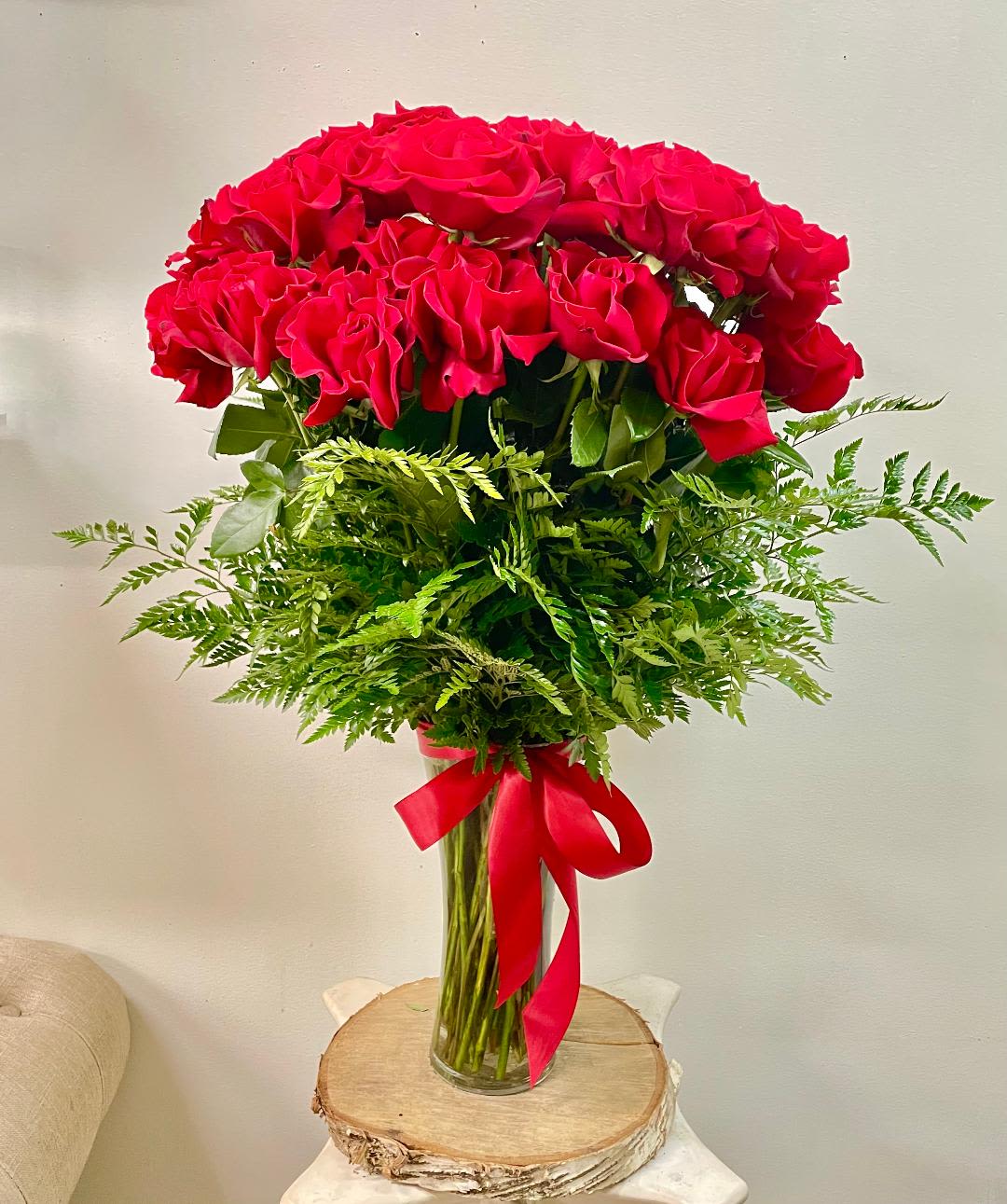 Three Dozen of Red Roses - A romantic and desirable rose, long stemmed to create a more elegant feel to the room. A red rose is the way to go, if you want to tell someone you love them.  Three dozen long stemmed roses in a glass vase.   Substitution may occur  Occasionally, substitution of flowers, plants, or containers may occur due to local and seasonal availability. We take the utmost care to ensure the same style and color scheme of the arrangement is maintained using similar items of equal or greater value.  The arrangement and/or vase may look different   The arrangement that is delivered contains the same number of flowers, but they are arranged throughout the entire vase. The vase shown may be out of stock, and we will replace it with a similar vase. For the arrangement the look, style and color may be different from what is pictured.  Why bud stage?  To ensure the freshest flower delivery, certain flowers may arrive in their bud stage. This increases your flowers’ shelf life so you can enjoy them longer. Please allow 2-3 days for the flowers to reach full bloom.