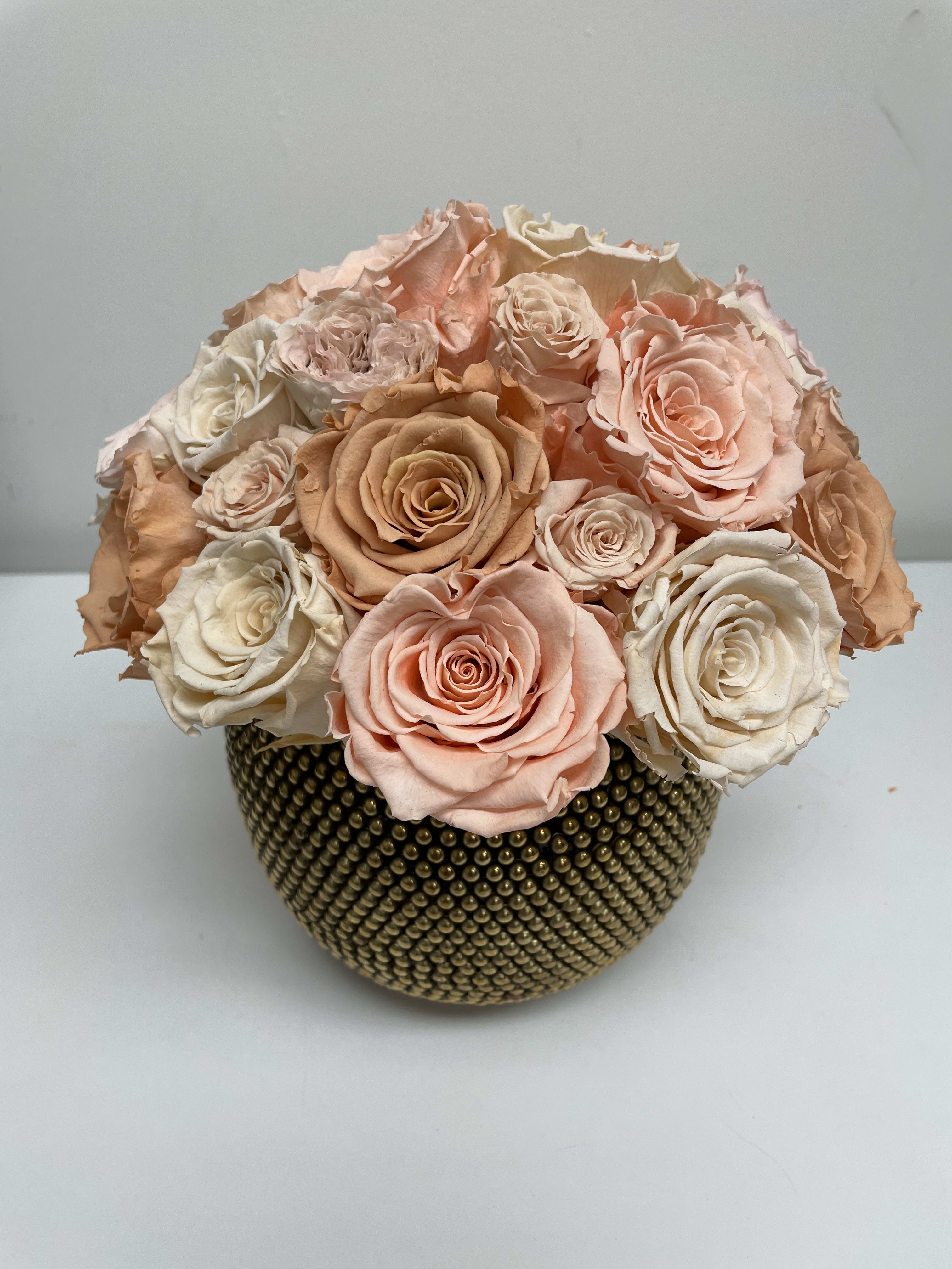 Pinks and Peaches - Pink and peach preserved roses in gold dot vase. Measure 9” x 9”