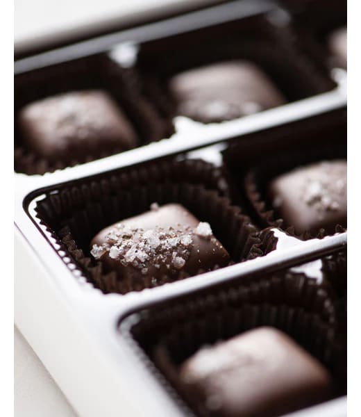 Bixby Dark Chocolate Sea Salt Caramels - Lg Box - Made on the coast of Maine in Rockland, Bixby &amp; Co. Sea-Salted Caramels are little chunks of premium caramel dipped in deluxe dark chocolate sprinkled with crystal of sea salt from the cold Maine ocean. Sure, technically they are candy, but they’re made to be a guiltless way for you to truly enjoy some Sweet Maine Goodness.  Contains: Milk, Soy. 