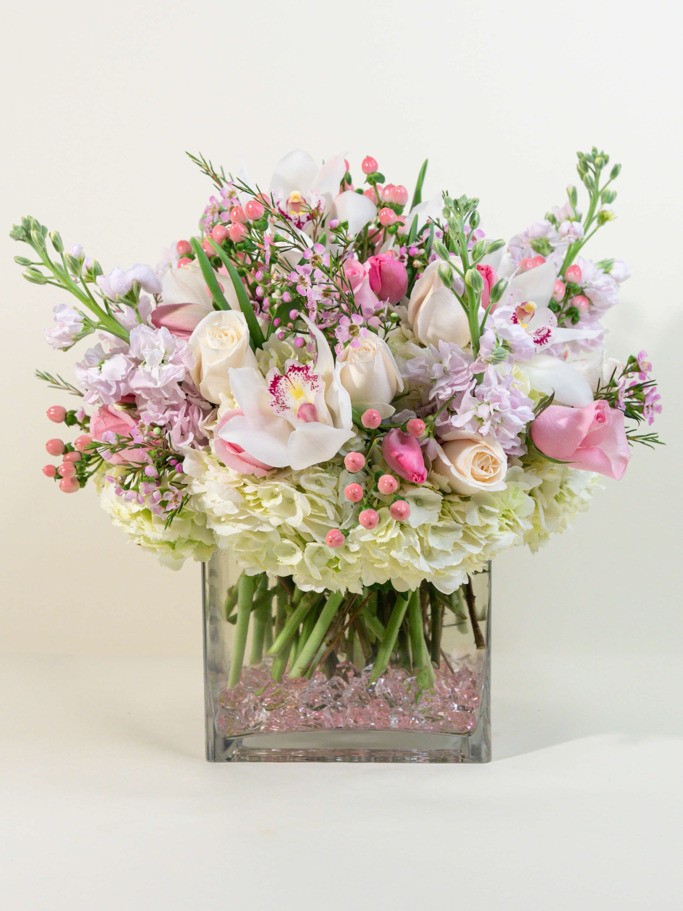 Girlie Girl! Girlie Girl! - Perfect for your best girl! Stock, hypericum, tulips, hydrangea, green or white cymbidium orchids, made beautifully!