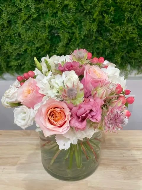Pretty in Pink Pretty in Pink - A beautiful mix of hydrangea, roses, and hypericum berries.